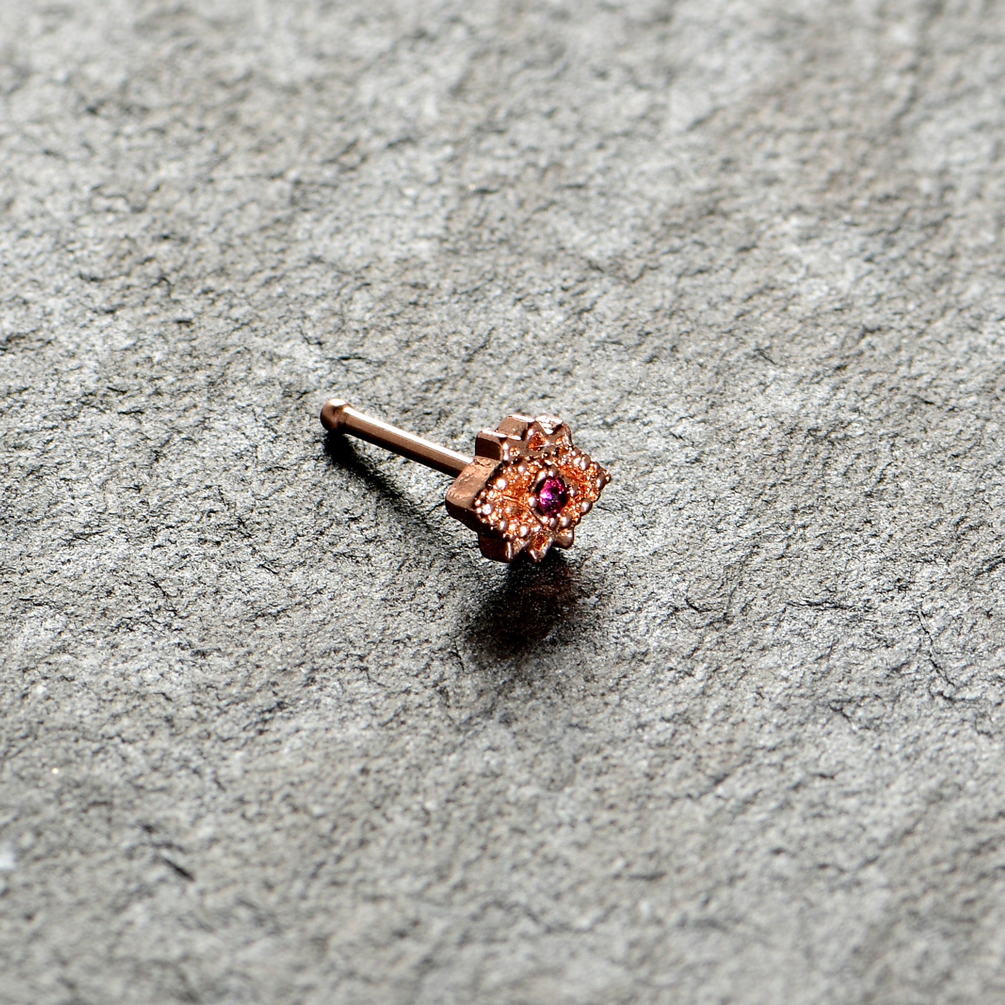 BodyCandy 20G 1/4 Red Gem Rose Gold Tone Octogram Star Nose Bone — alternative angle