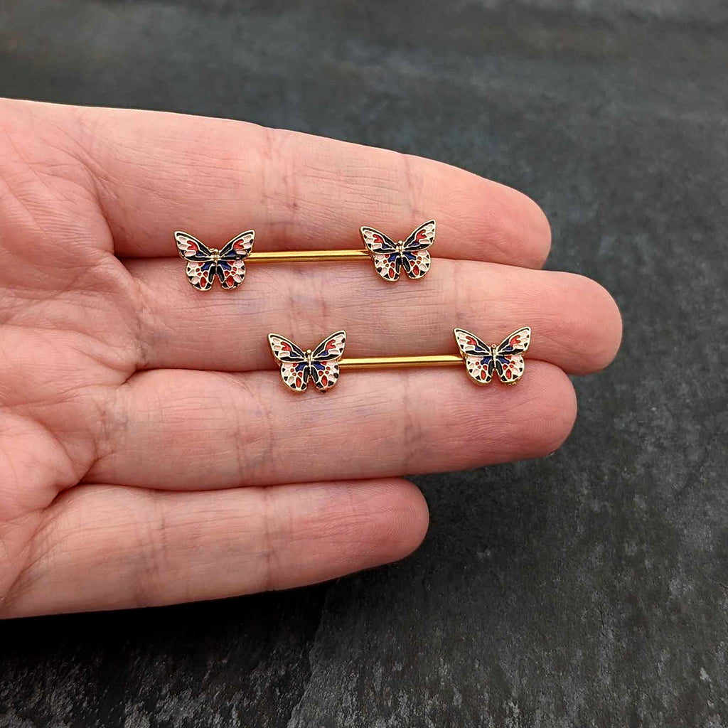 BodyCandy 14G 5/8 Gold Tone Pink Blue Red Butterfly Barbell Nipple Ring Set — in-use photo