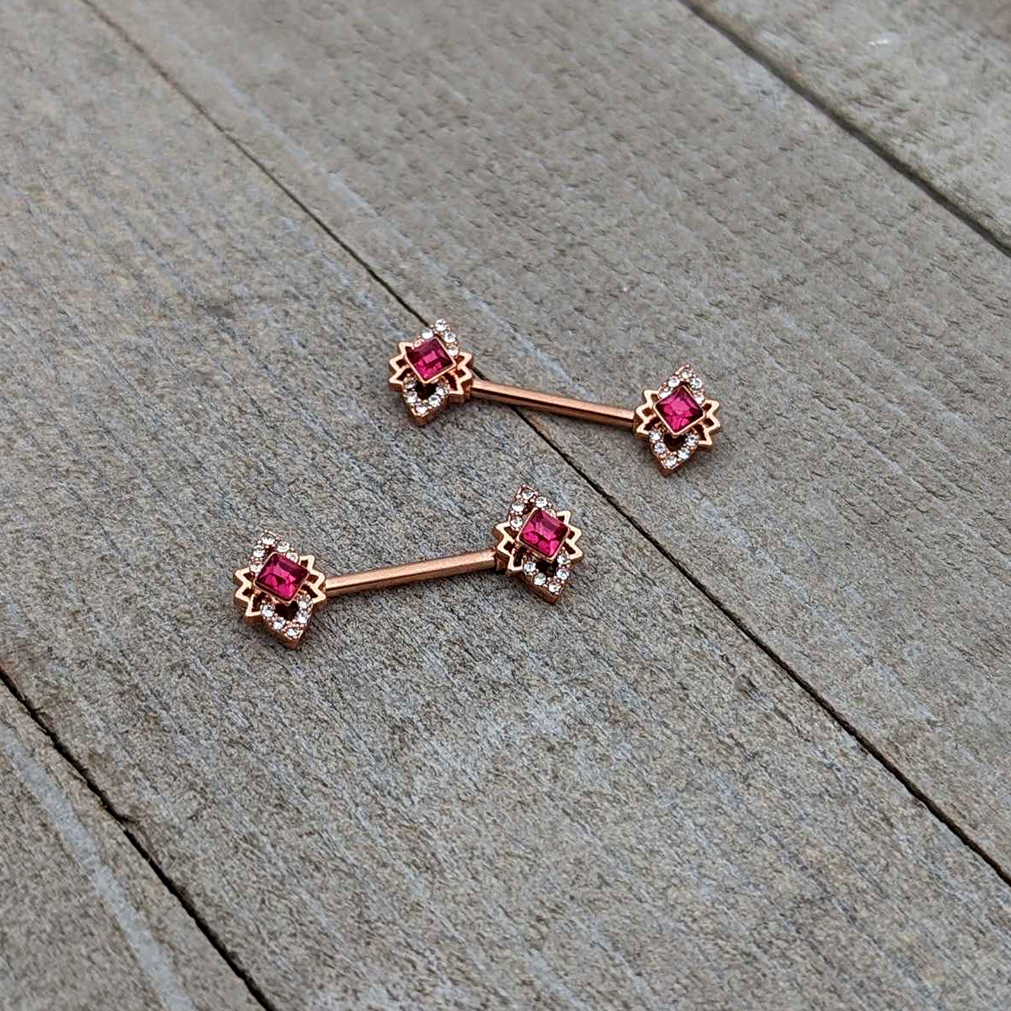 BodyCandy 14G 9/16 Red Gem Rosy Tone Octogram Star Barbell Nipple Ring Set — back view