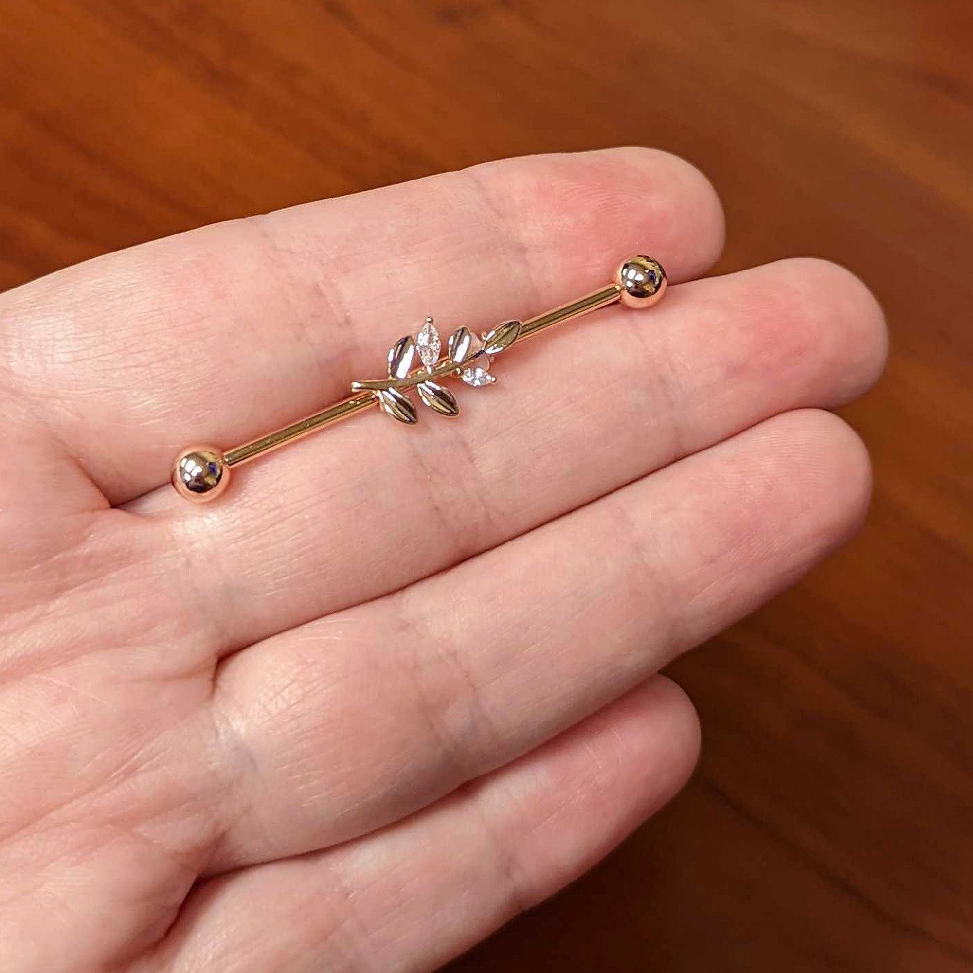 BodyCandy 14G Clear CZ Gem Rose Gold Hue Simple Leaf Industrial Barbell 38mm — lifestyle context