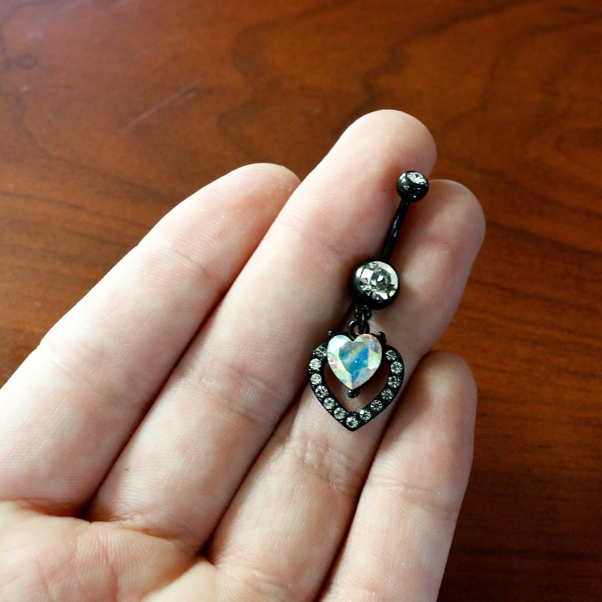 BodyCandy Clear Aurora Gem Black Rococo Heart Dangle Belly Ring — back view