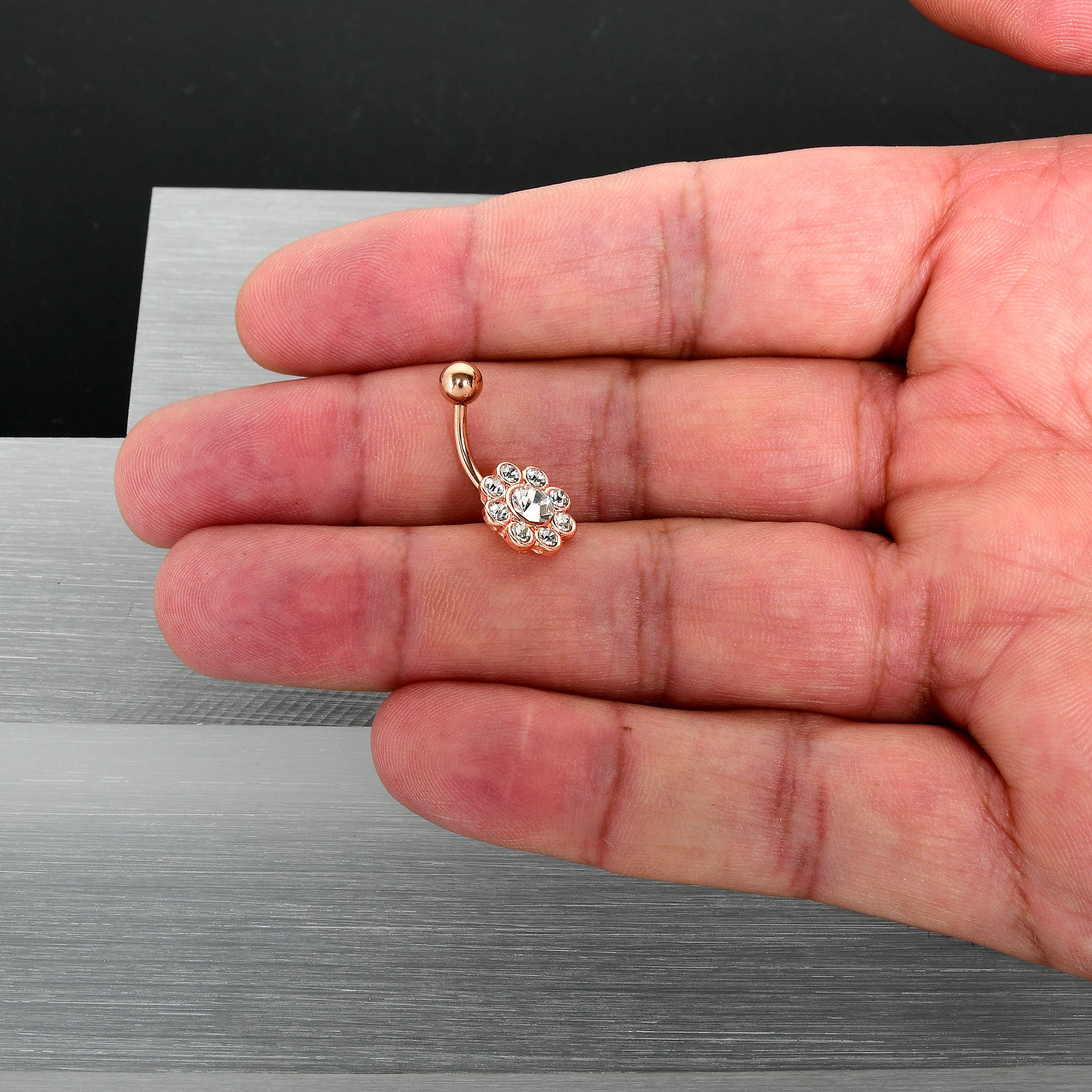 BodyCandy Clear Gem Rose Gold Tone Whimsy Flower Belly Ring — in-use photo