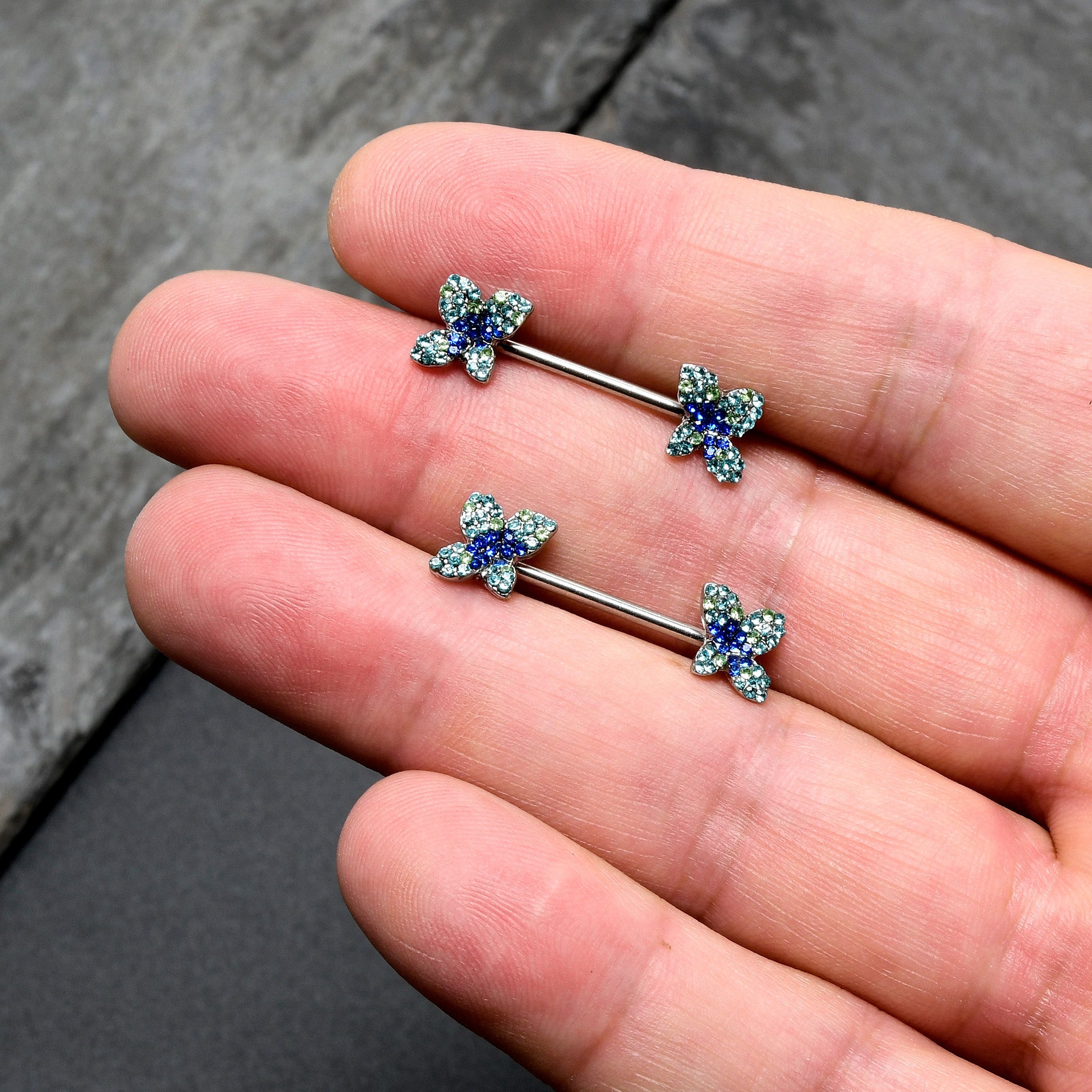 BodyCandy 14G 9/16 Blue Gem Glamour Butterfly Barbell Nipple Ring Set — in-use photo