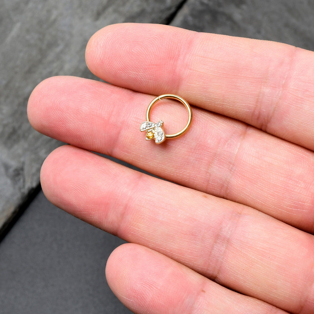 BodyCandy 16G 3/8 Yellow Gem Gold Tone Fashion Winged Bug Hinged Segment Ring — in-use photo