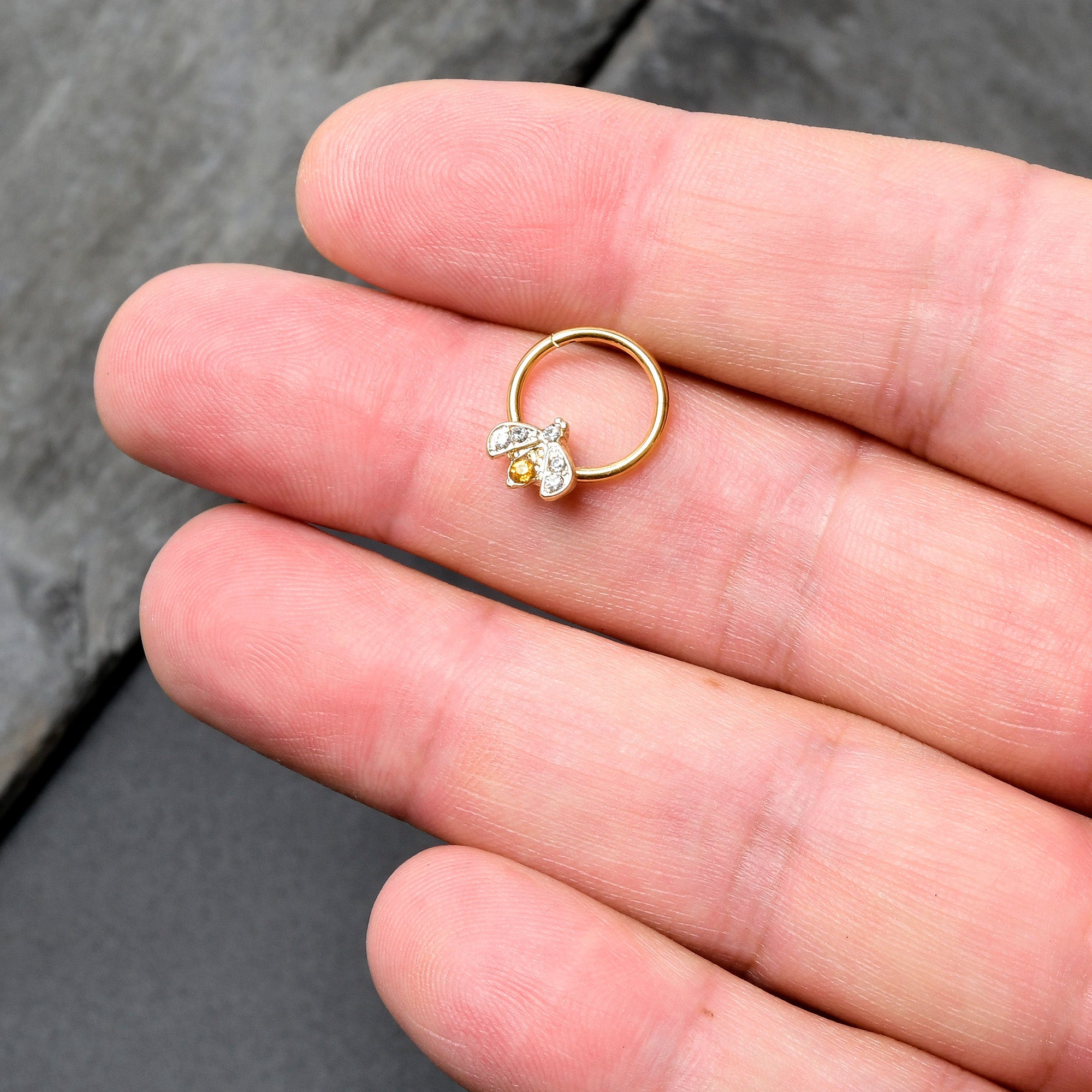 BodyCandy 16G 3/8 Yellow Gem Gold Tone Fashion Winged Bug Hinged Segment Ring — in-use photo