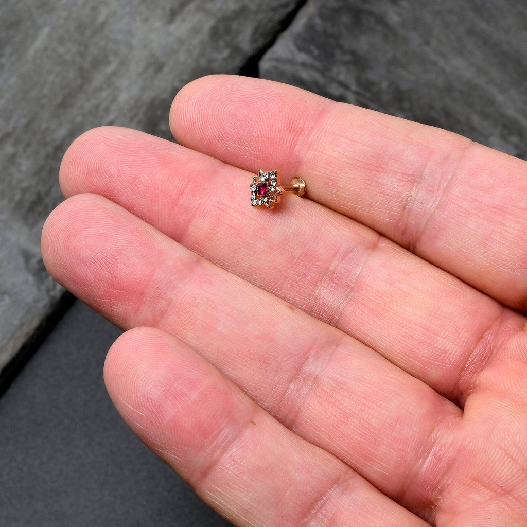 BodyCandy 16G 5/16 Red Gem Rose Gold Tone Octogram Star Labret Monroe Tragus — in-use photo
