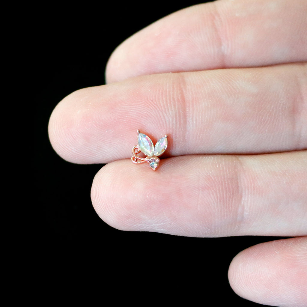 BodyCandy 16G 5/16 Aurora CZ Gem Rosy Tone Fleur de Lis Butterfly Labret Monroe Tragus — in-use photo