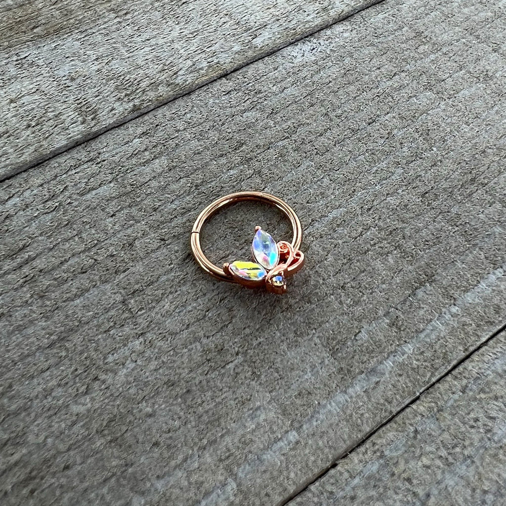 BodyCandy 16G 3/8 Aurora CZ Gem Rosy Tone Fleur de Lis Butterfly Hinged Segment Ring — side view