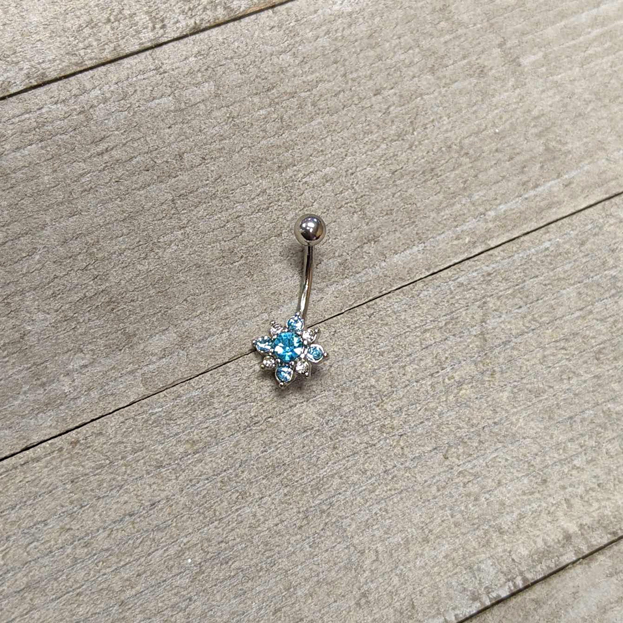 BodyCandy Blue Clear Gem Stylish Snowflake Holiday Belly Ring — side view
