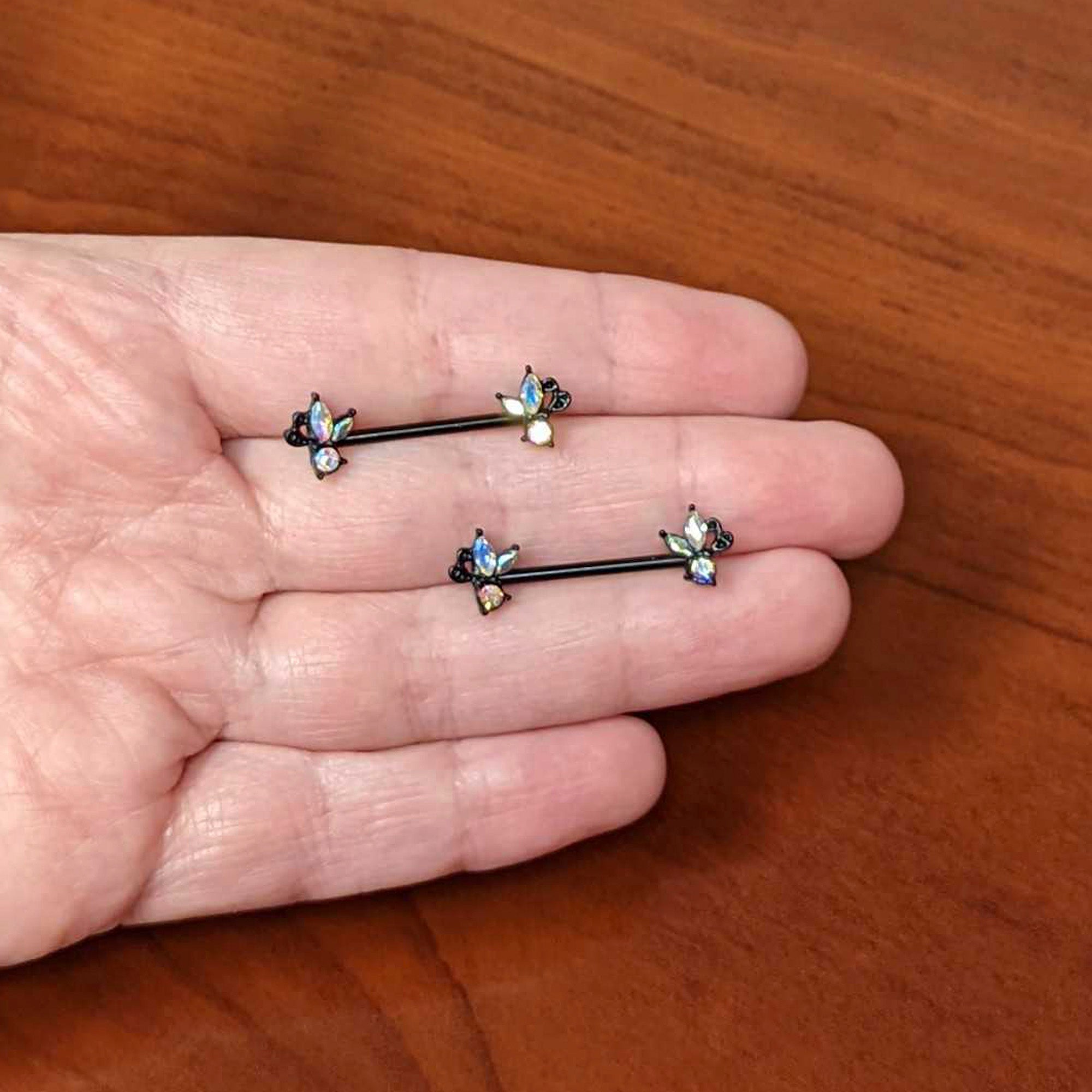 BodyCandy 14G 19mm Aurora CZ Gem Black Fleur de Lis Butterfly Barbell Nipple Ring Set — side view