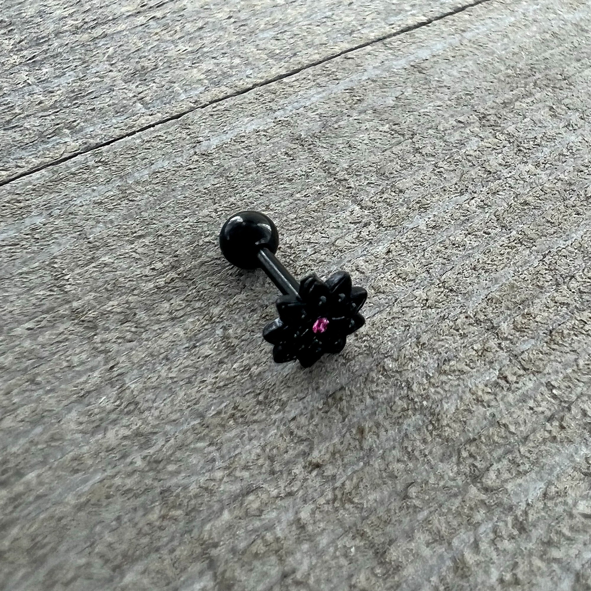 BodyCandy 16G 1/4 Pink Gem Black Midnight Flower Cartilage Tragus Earring — in-use photo