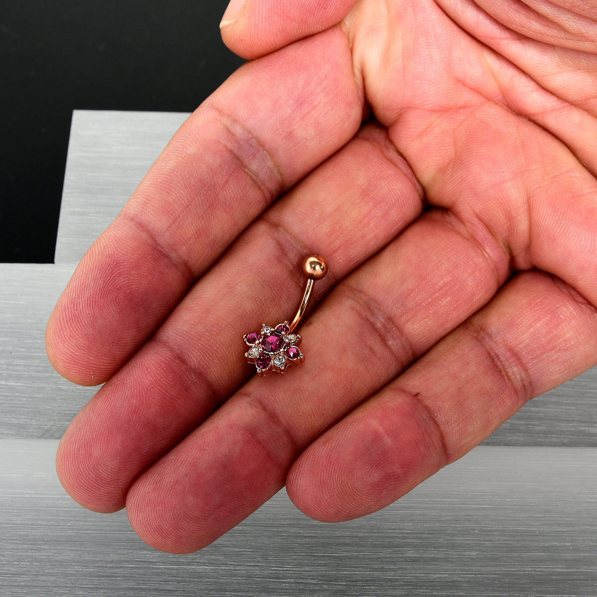 BodyCandy Pink Clear Gem Rose Gold Tone Rococo Star Belly Ring — detail close-up