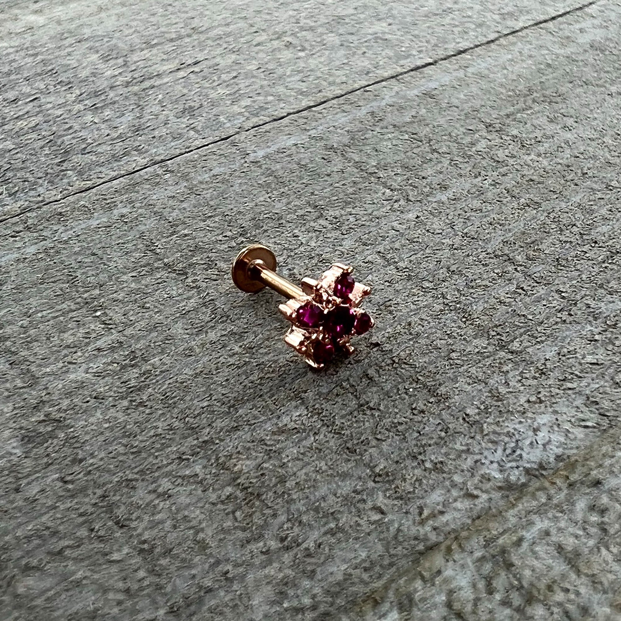 BodyCandy 16G 5/16 Pink Gem Rose Gold Tone Sumptuous Star Labret Tragus — in-use photo