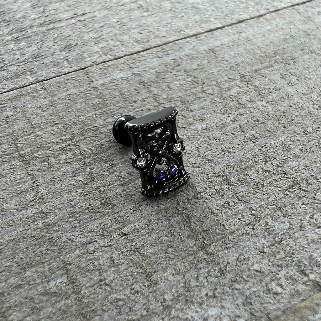 BodyCandy 16G 1/4 Purple Gem Black Gothic Hourglass Cartilage Tragus Earring — in-use photo