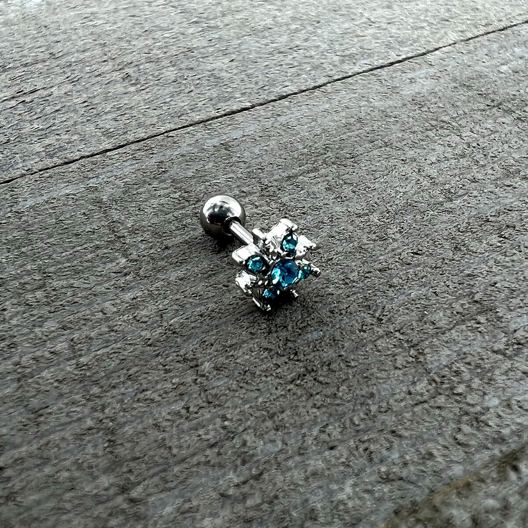 BodyCandy 16G 1/4 Blue Gem Stylish Snowflake Cartilage Tragus Earring — in-use photo