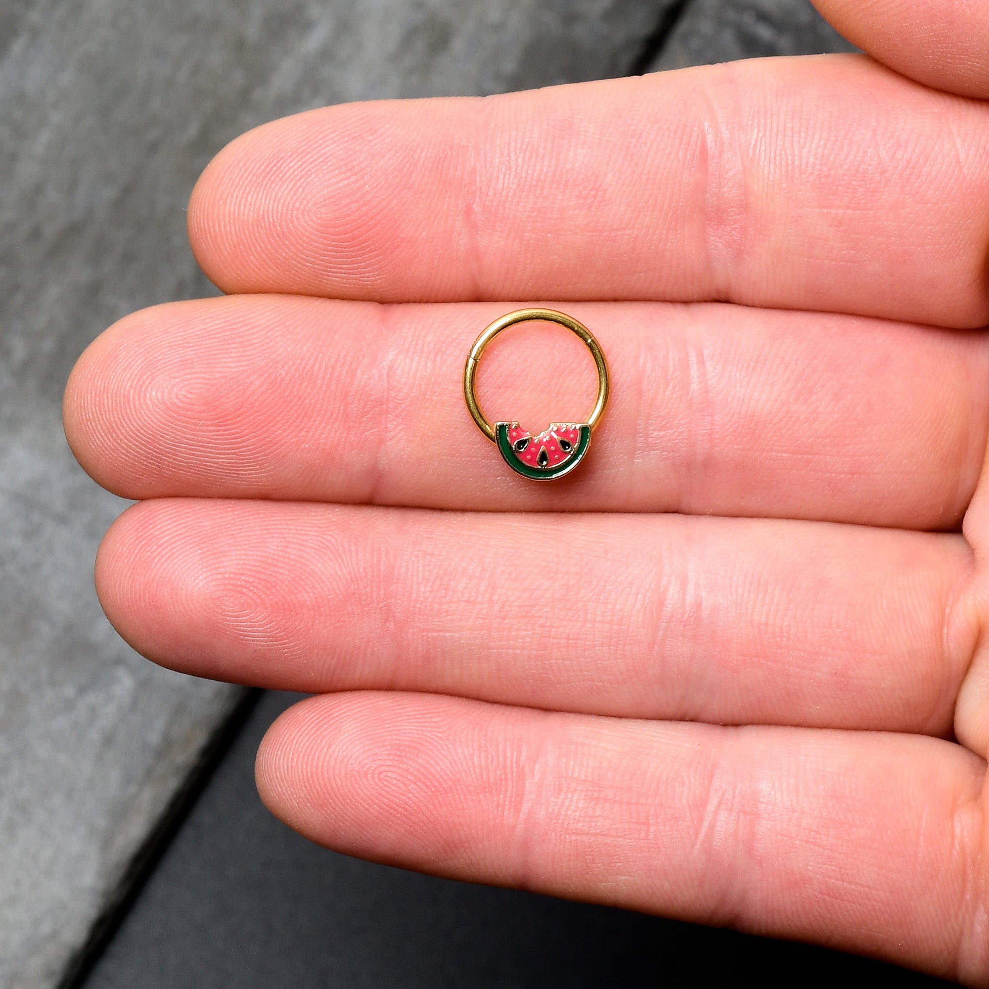 BodyCandy 16G 3/8 Gold Tone Watermelon Bite Hinged Segment Ring — lifestyle context