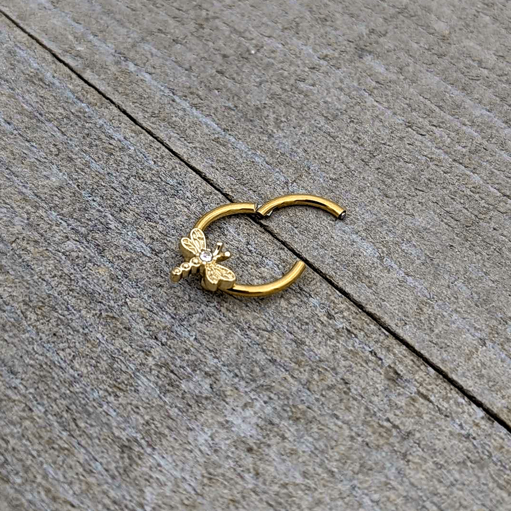 BodyCandy 16G 3/8 Clear Gem Gold Tone Flying Dragonfly Hinged Segment Ring — in-use photo