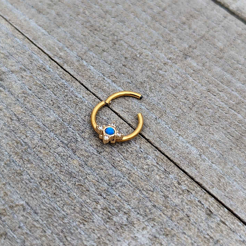 BodyCandy 16G 3/8 Blue Synthetic Opal Gold Hue Rhombus Hinged Segment Ring — in-use photo