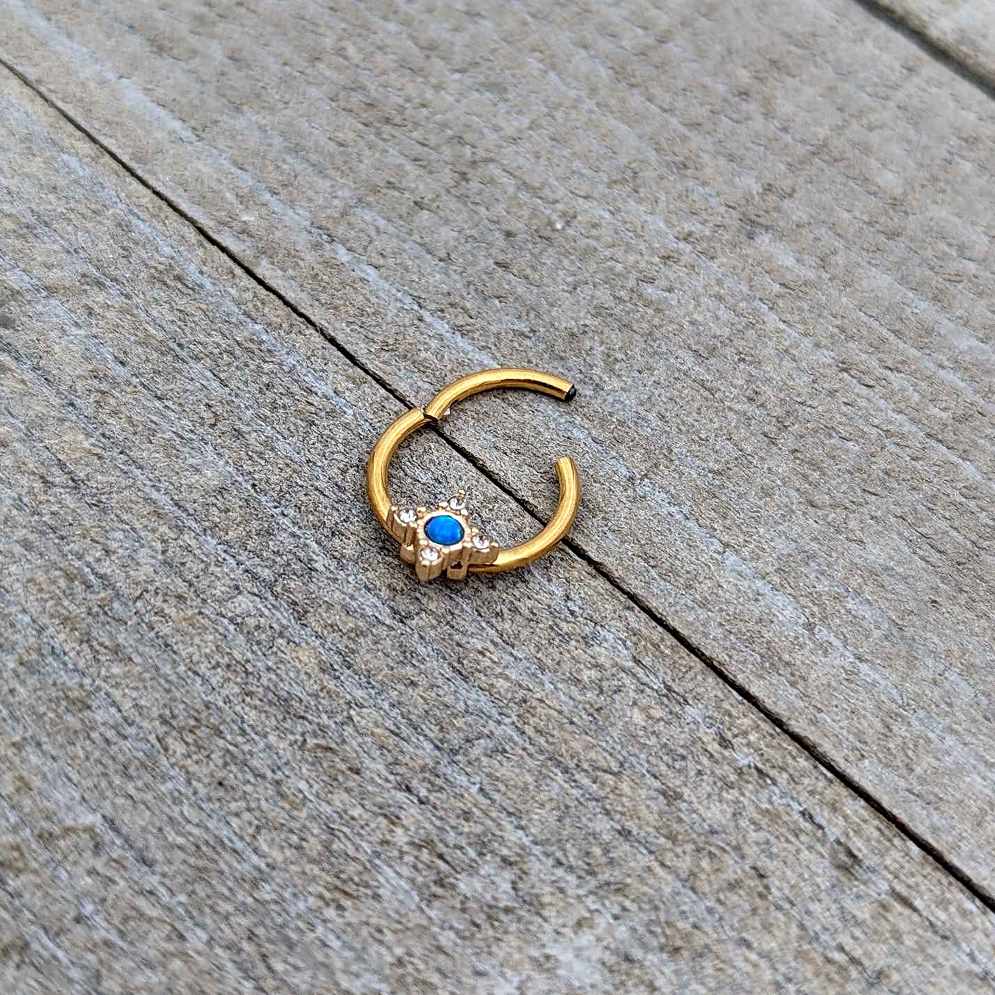 BodyCandy 16G 3/8 Blue Synthetic Opal Gold Hue Rhombus Hinged Segment Ring — in-use photo