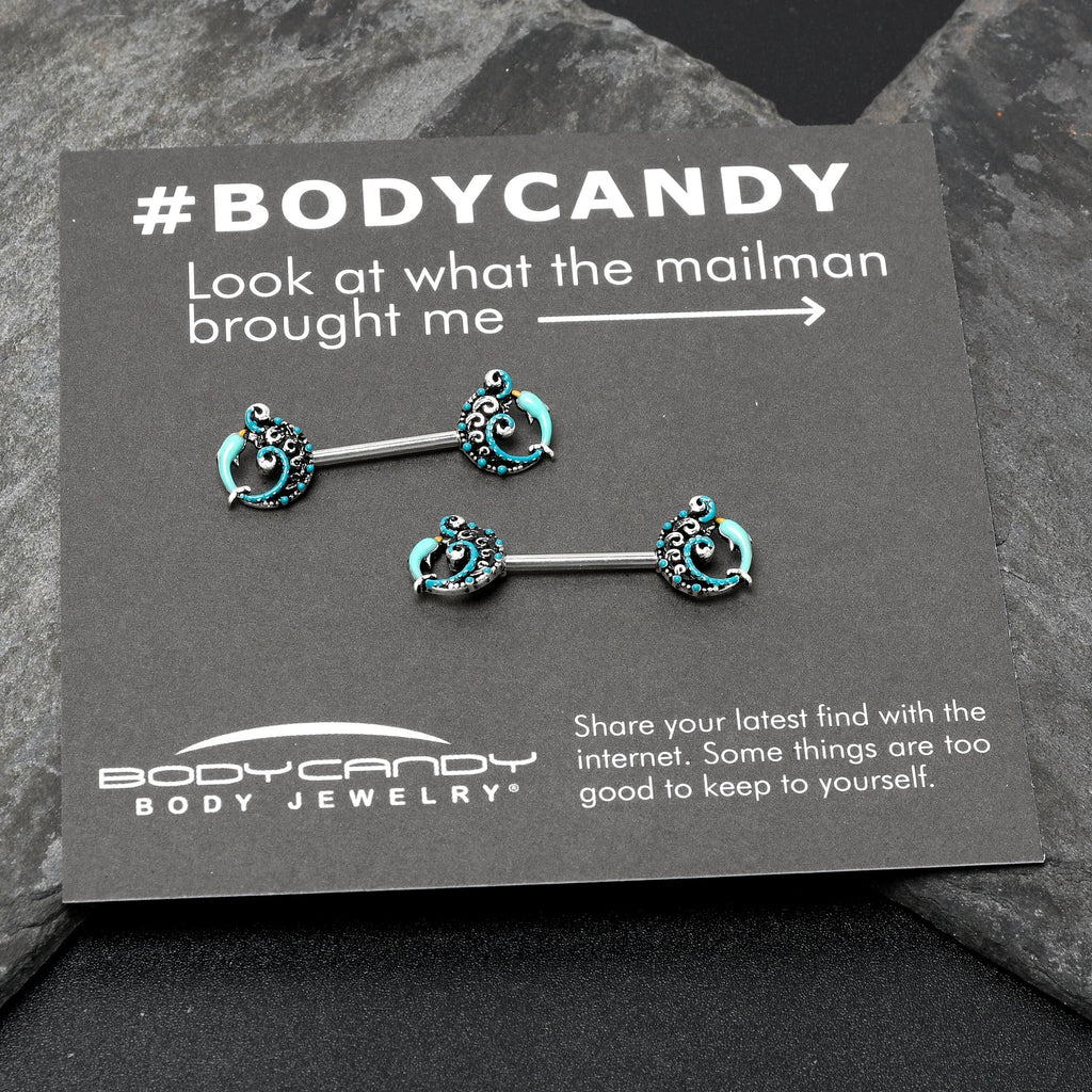 BodyCandy 14G 9/16 Leaping Blue Dolphin Barbell Nipple Ring Set — in-use photo