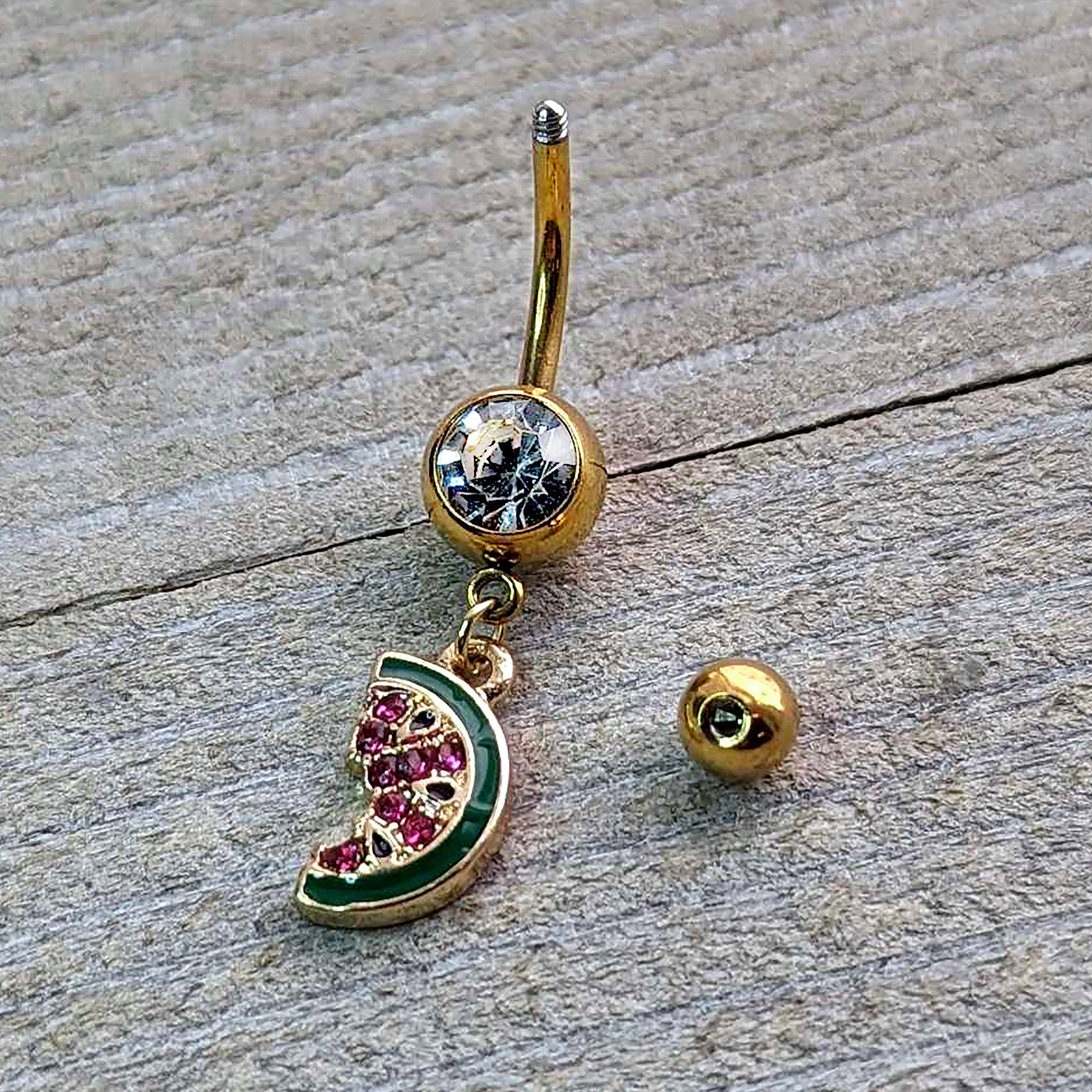 BodyCandy Clear Gem Gold Tone Watermelon Bite Dangle Belly Ring — side view