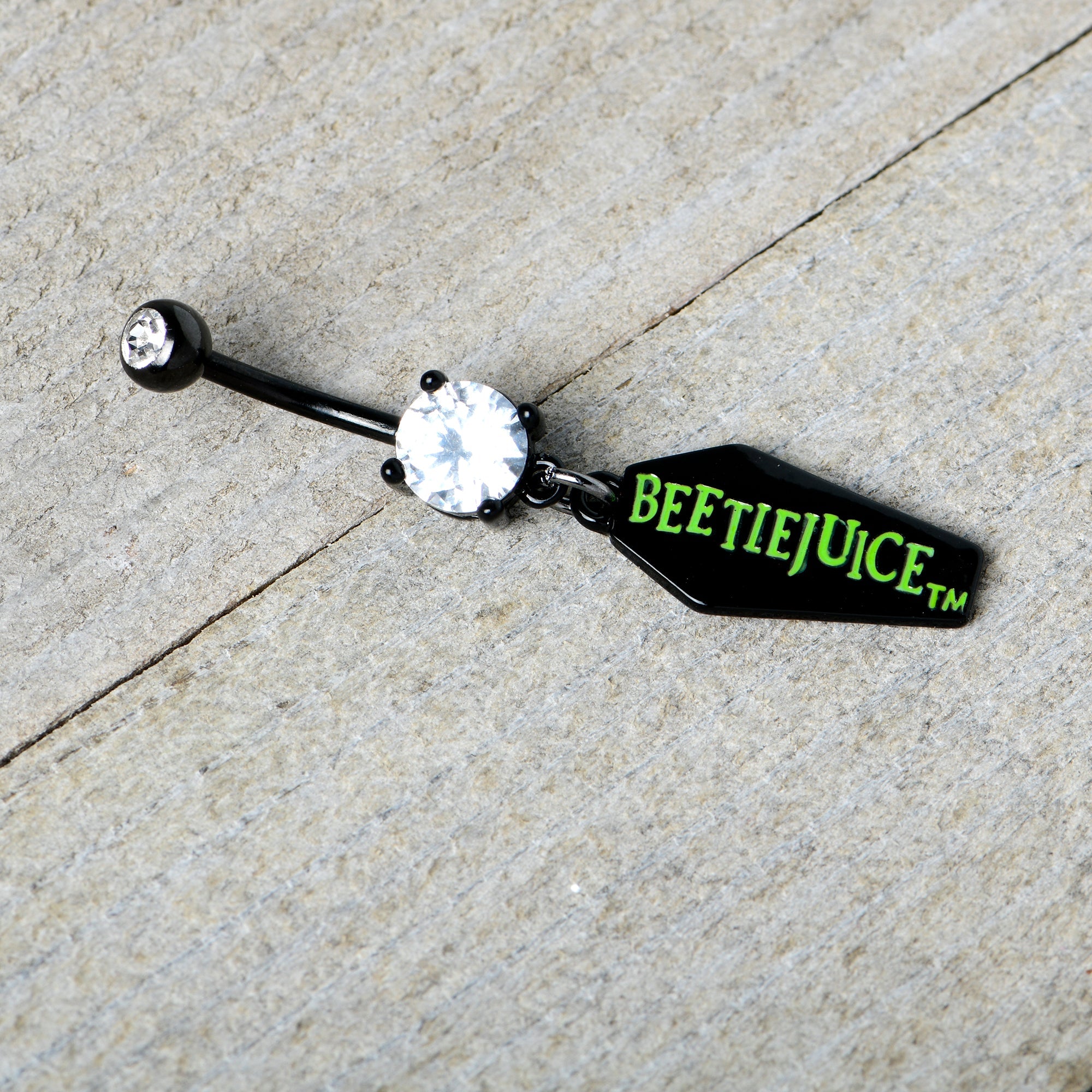 BodyCandy Clear Gem Black Officially Licensed Beetlejuice Coffin Dangle Belly Ring — in-use photo