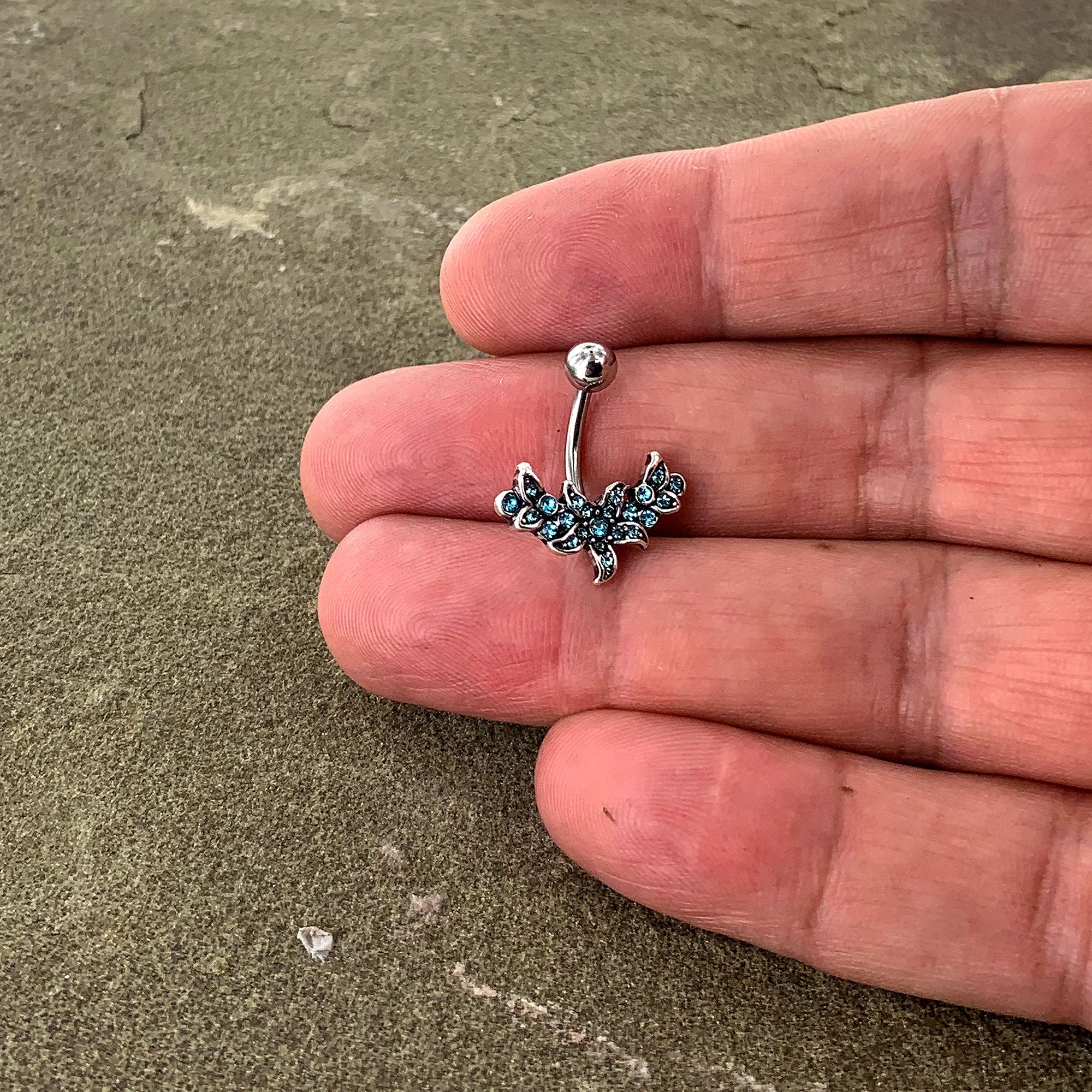 BodyCandy Blue Gem Flower Garland Belly Ring — detail close-up