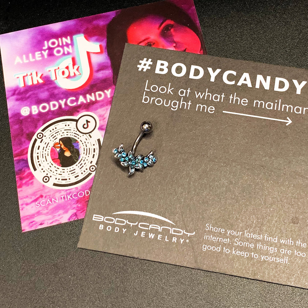 BodyCandy Blue Gem Flower Garland Belly Ring — in-use photo