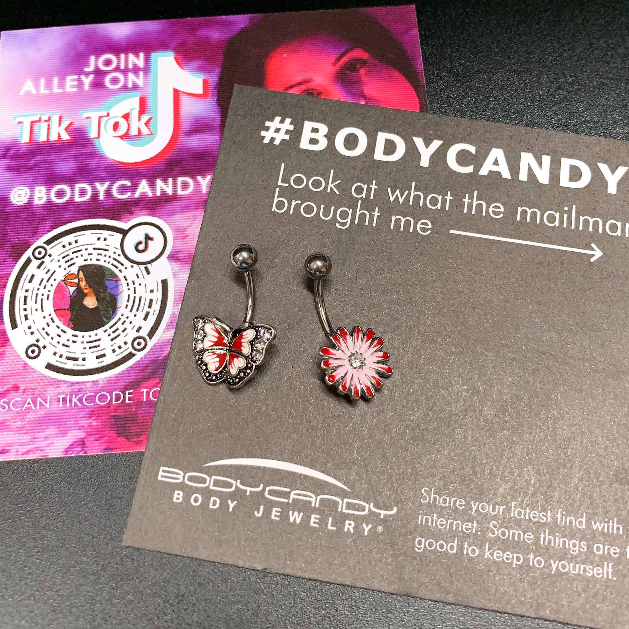 BodyCandy Clear Gem Red Light Pink Butterfly Flower Belly Ring Set of 2 — detail close-up