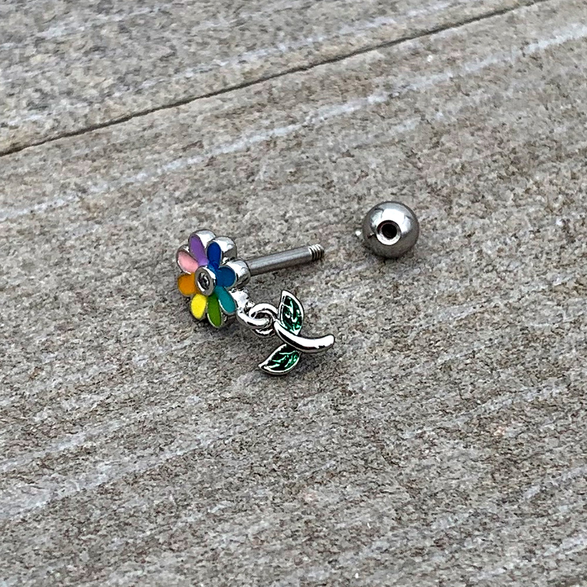 BodyCandy 16G 1/4 Clear Gem Pride Rainbow Flower Dangle Cartilage Tragus — back view