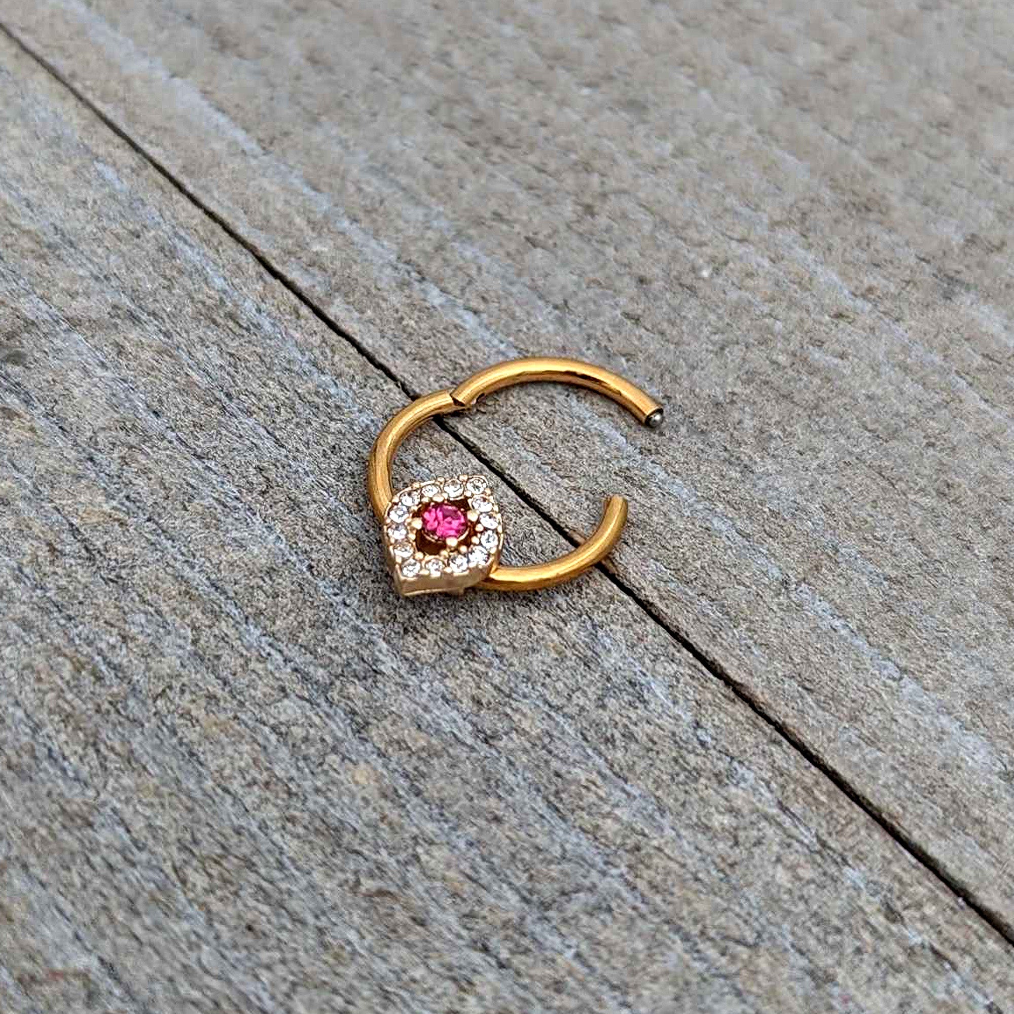 BodyCandy 16G 3/8 Clear Pink Gem Gold Tone Open Eye Hinged Segment Ring — in-use photo