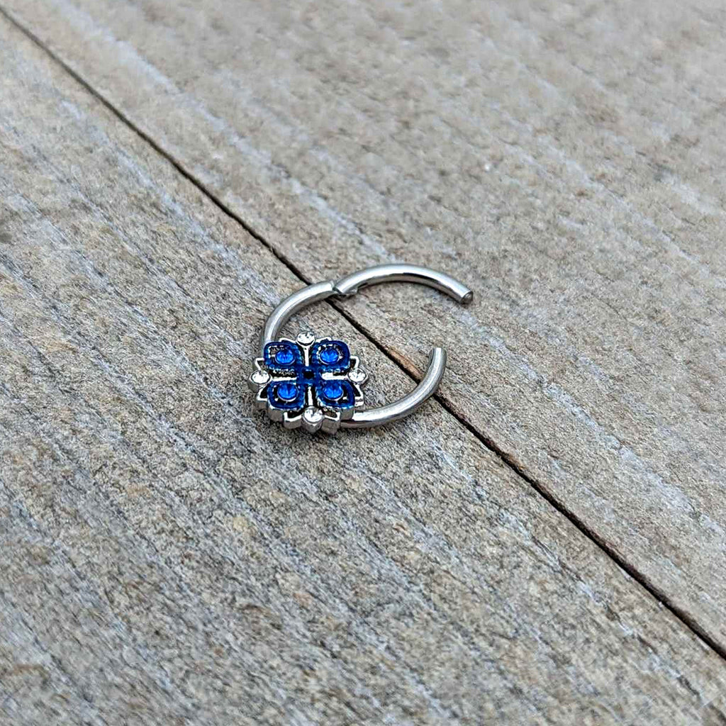 BodyCandy 16G 3/8 Blue Clear Gem Embellished Cross Hinged Segment Ring — in-use photo