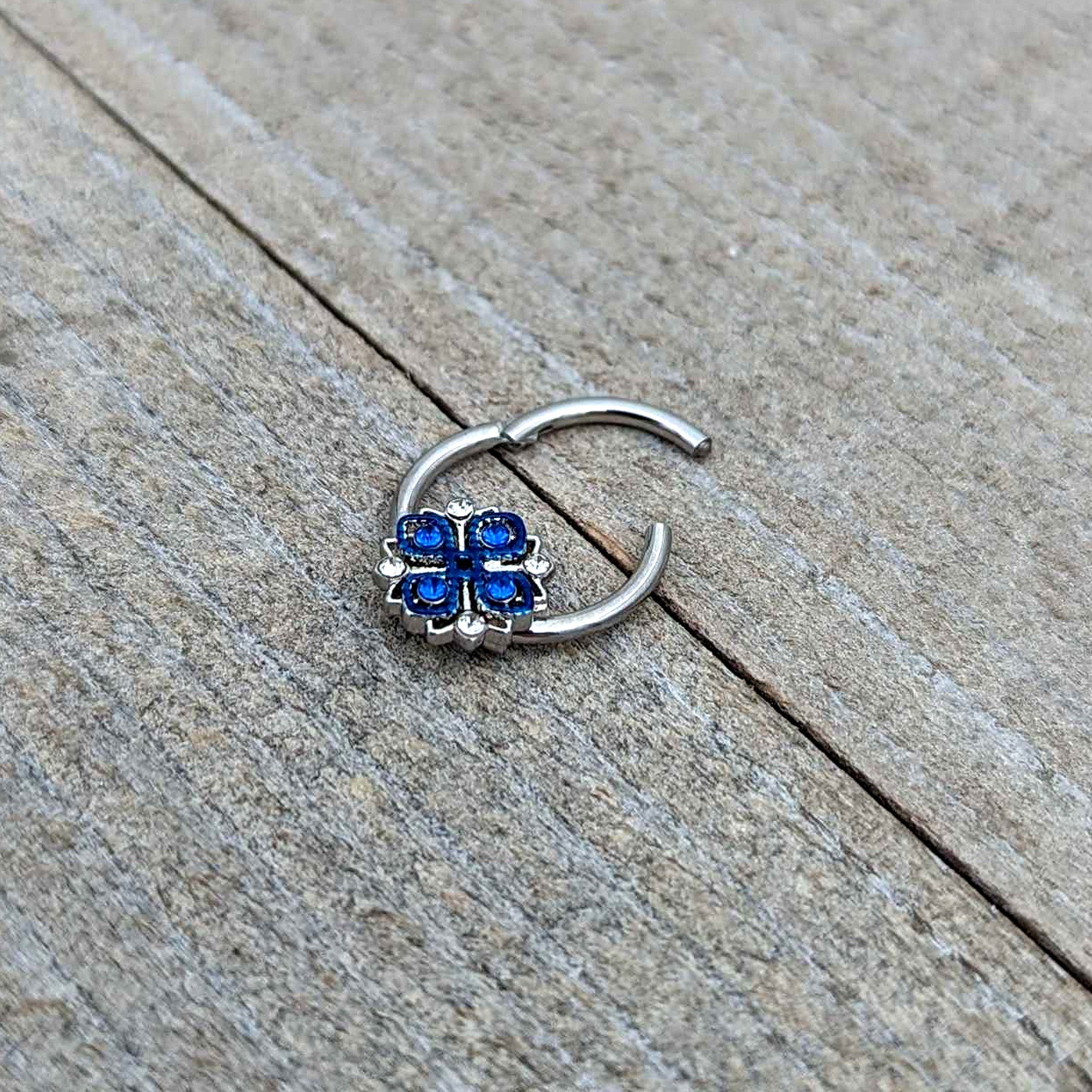BodyCandy 16G 3/8 Blue Clear Gem Embellished Cross Hinged Segment Ring — in-use photo