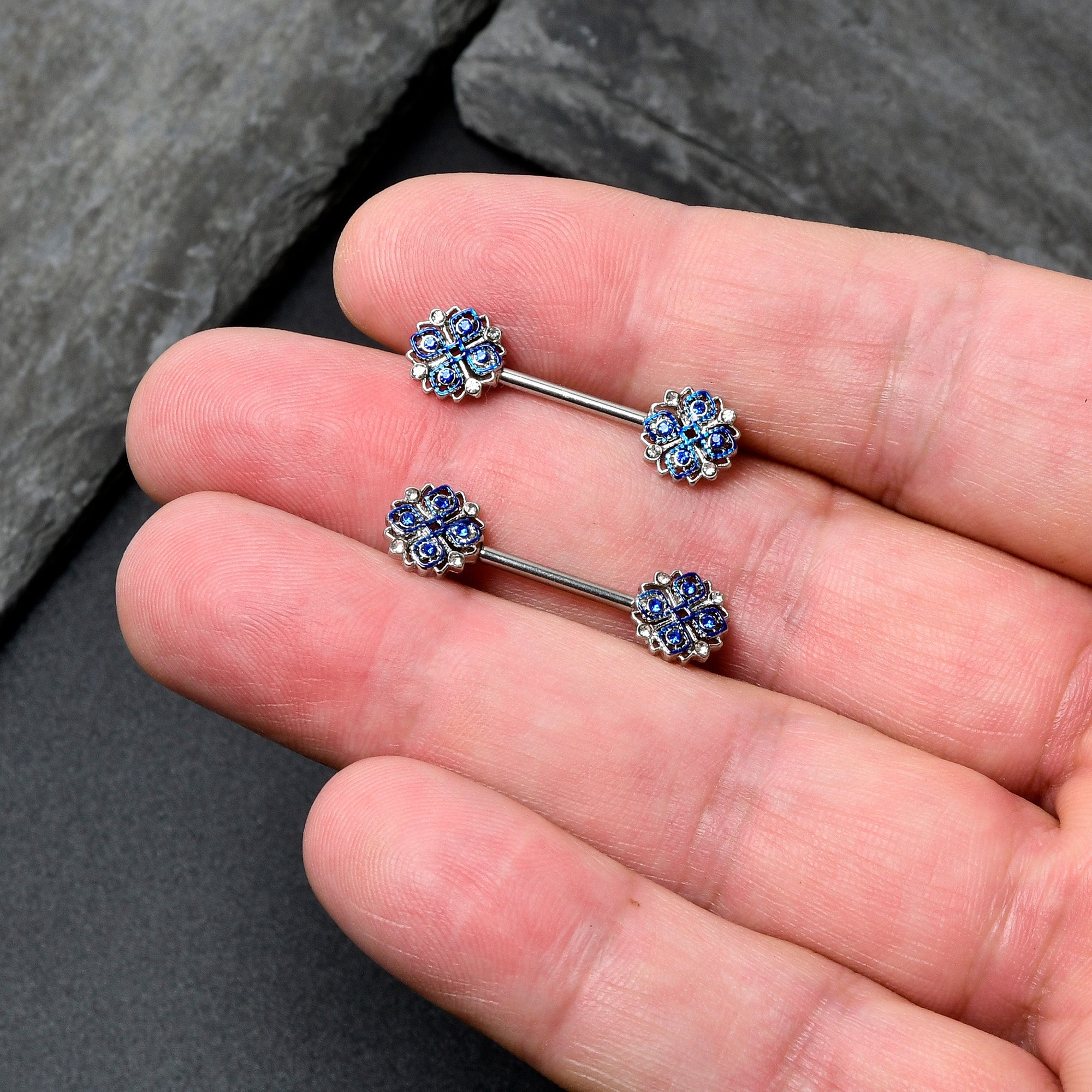 BodyCandy 14G 9/16 Clear Blue Gem Embellished Cross Barbell Nipple Ring Set — in-use photo