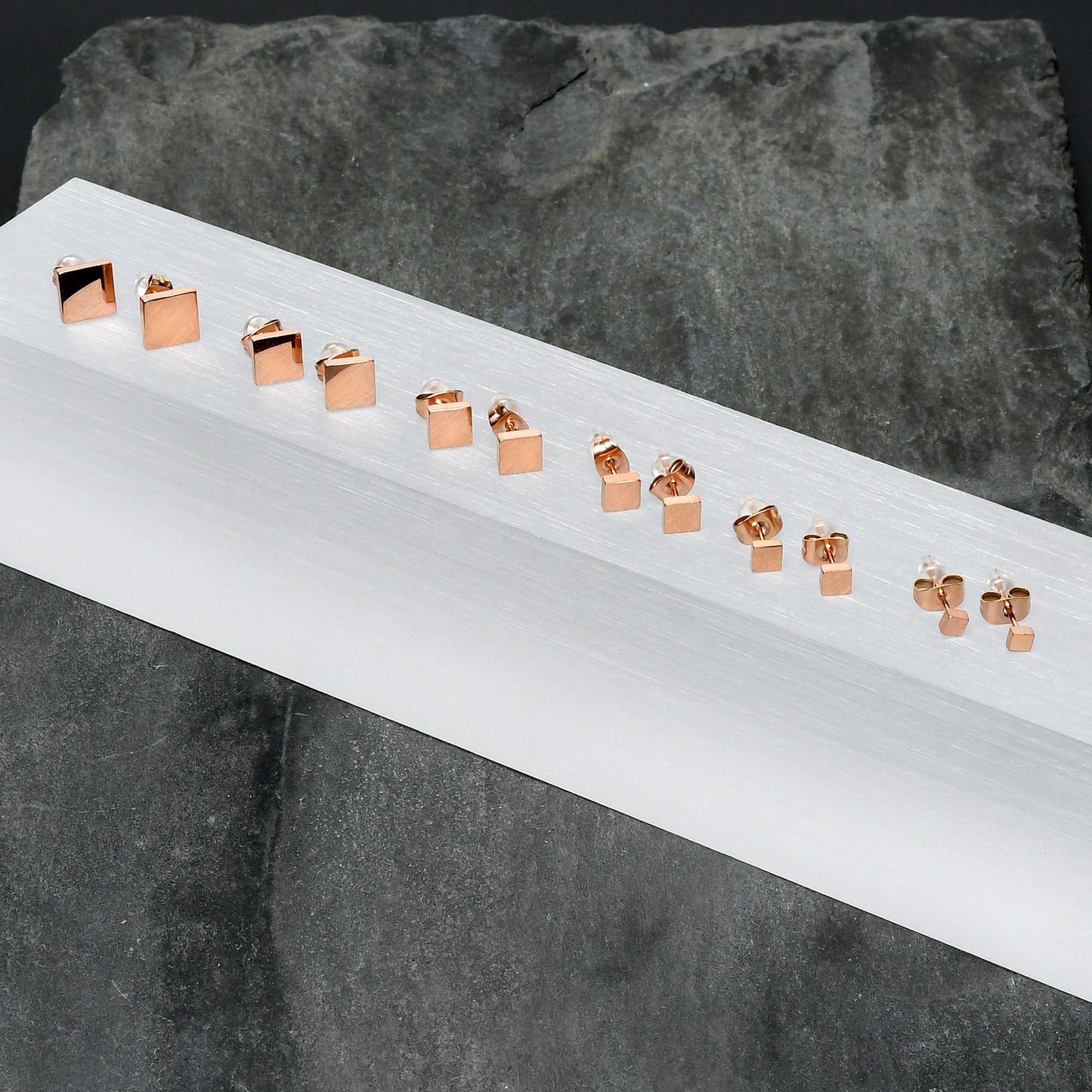 BodyCandy 3mm-8mm Square Stud Rose Gold Tone 316L Stainless Steel Earrings 6 Pack — lifestyle context