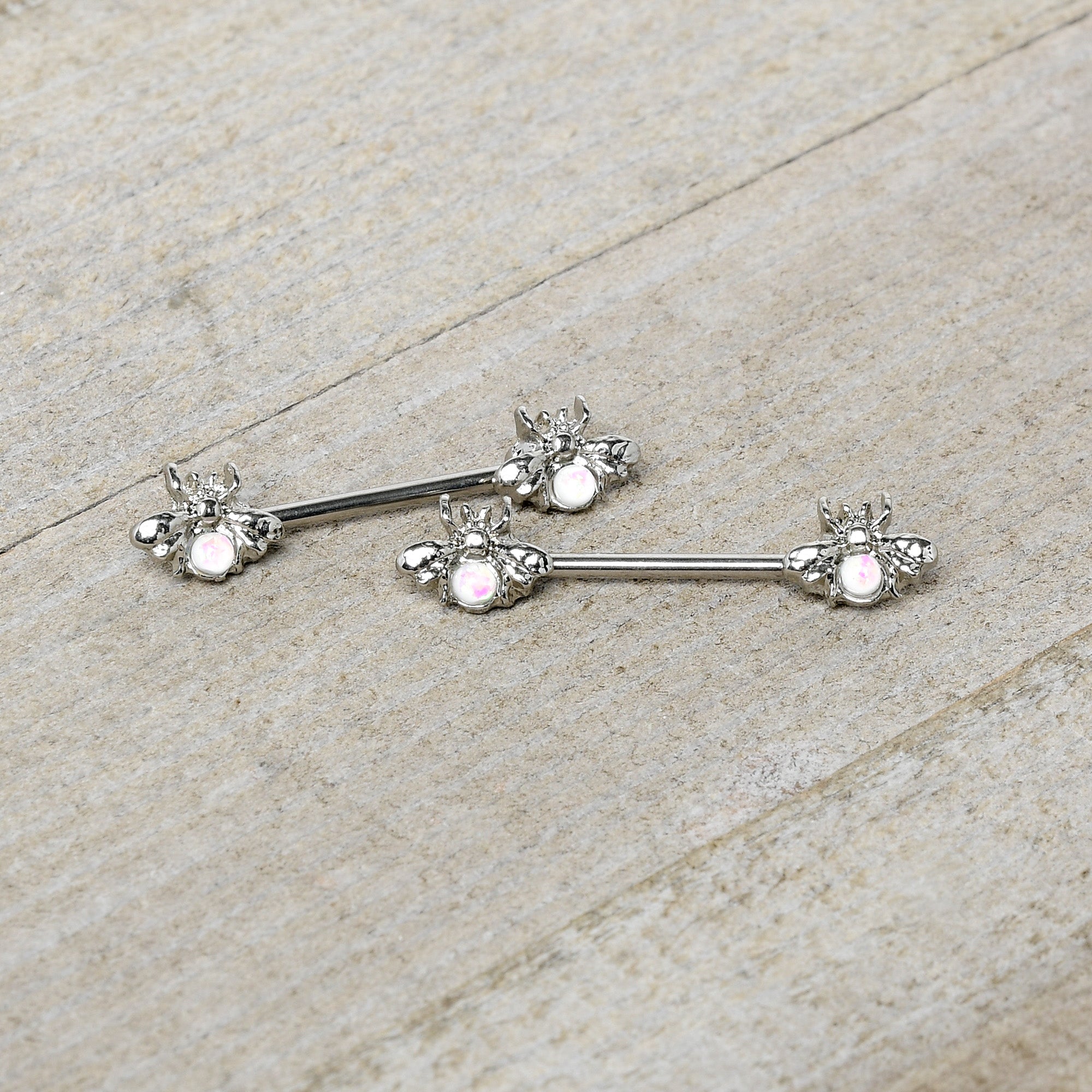 BodyCandy 14G 9/16 White Faux Opal Bee Beauty Insect Barbell Nipple Ring Set — side view