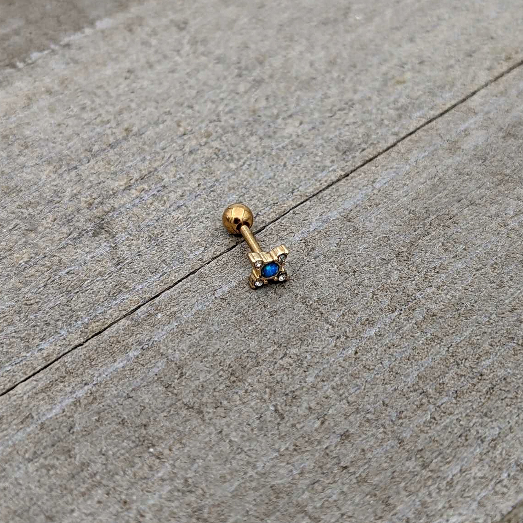 BodyCandy 16G 1/4 Blue Synthetic Opal Gold Tone Rhombus Cartilage Earring — in-use photo
