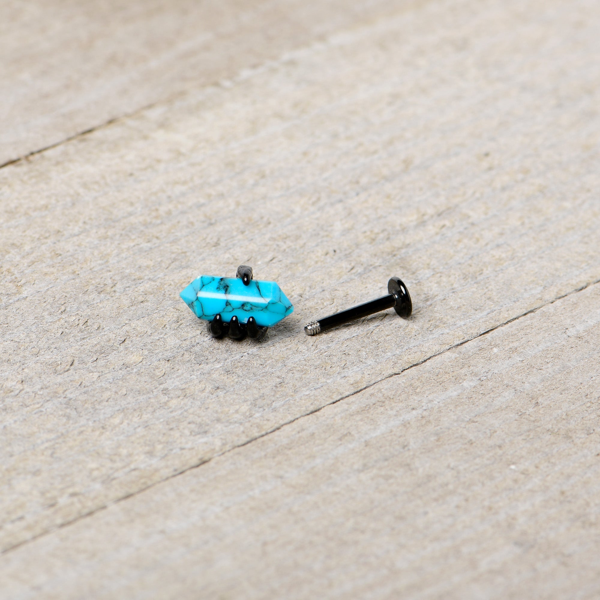 BodyCandy 16G 5/16 Blue Turquoise Black Claw Obelisk Labret Monroe Tragus — in-use photo