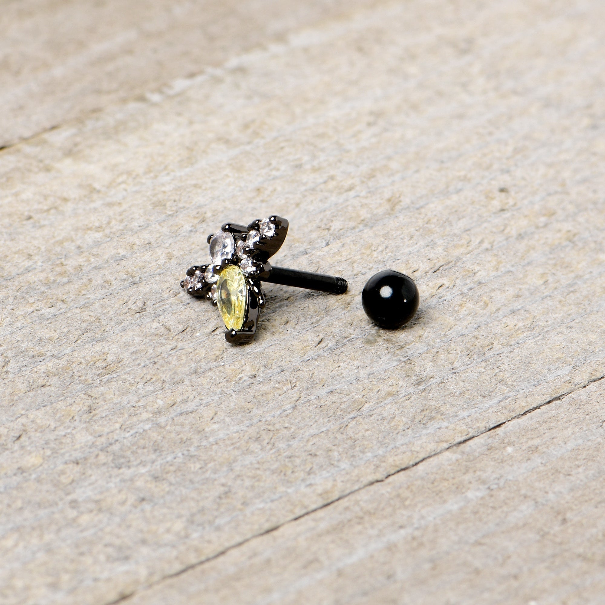 BodyCandy 16G 1/4 Clear Yellow Gem Black Butterfly Cartilage Tragus Earring — in-use photo