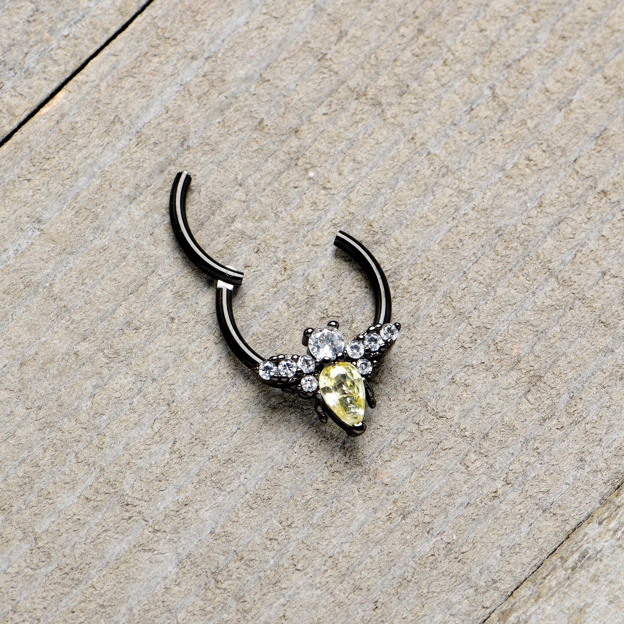 BodyCandy 16G 3/8 Yellow Clear Gem Black Butterfly Hinged Segment Ring — in-use photo