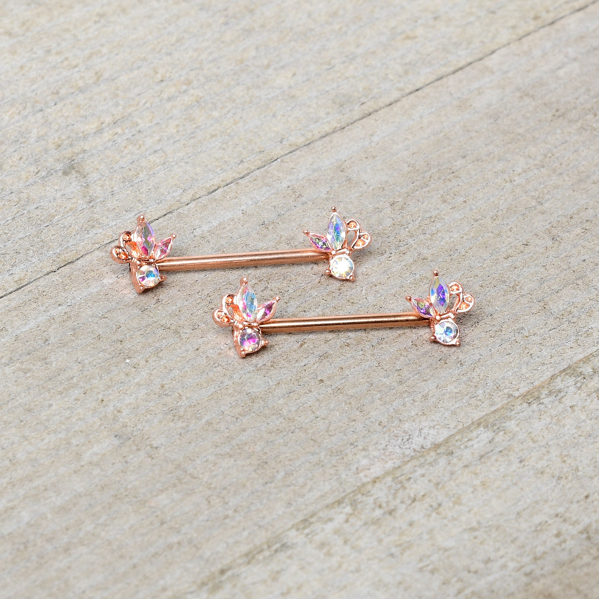 BodyCandy 14G 5/8 Aurora CZ Gem Rosy Hue Fleur de Lis Butterfly Barbell Nipple Ring Set — side view