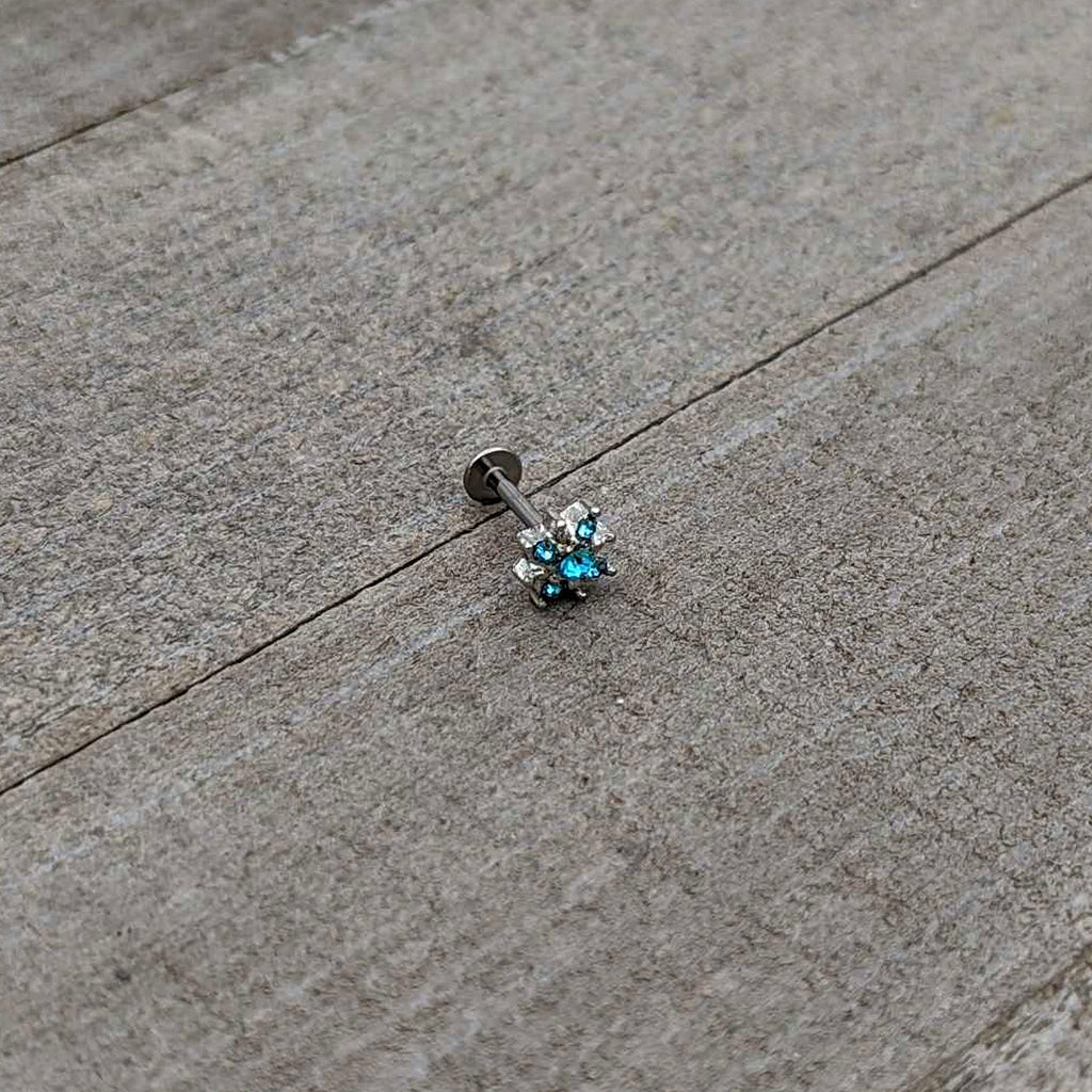BodyCandy 16G 5/16 Blue Gem Stylish Snowflake Labret Monroe Tragus — in-use photo