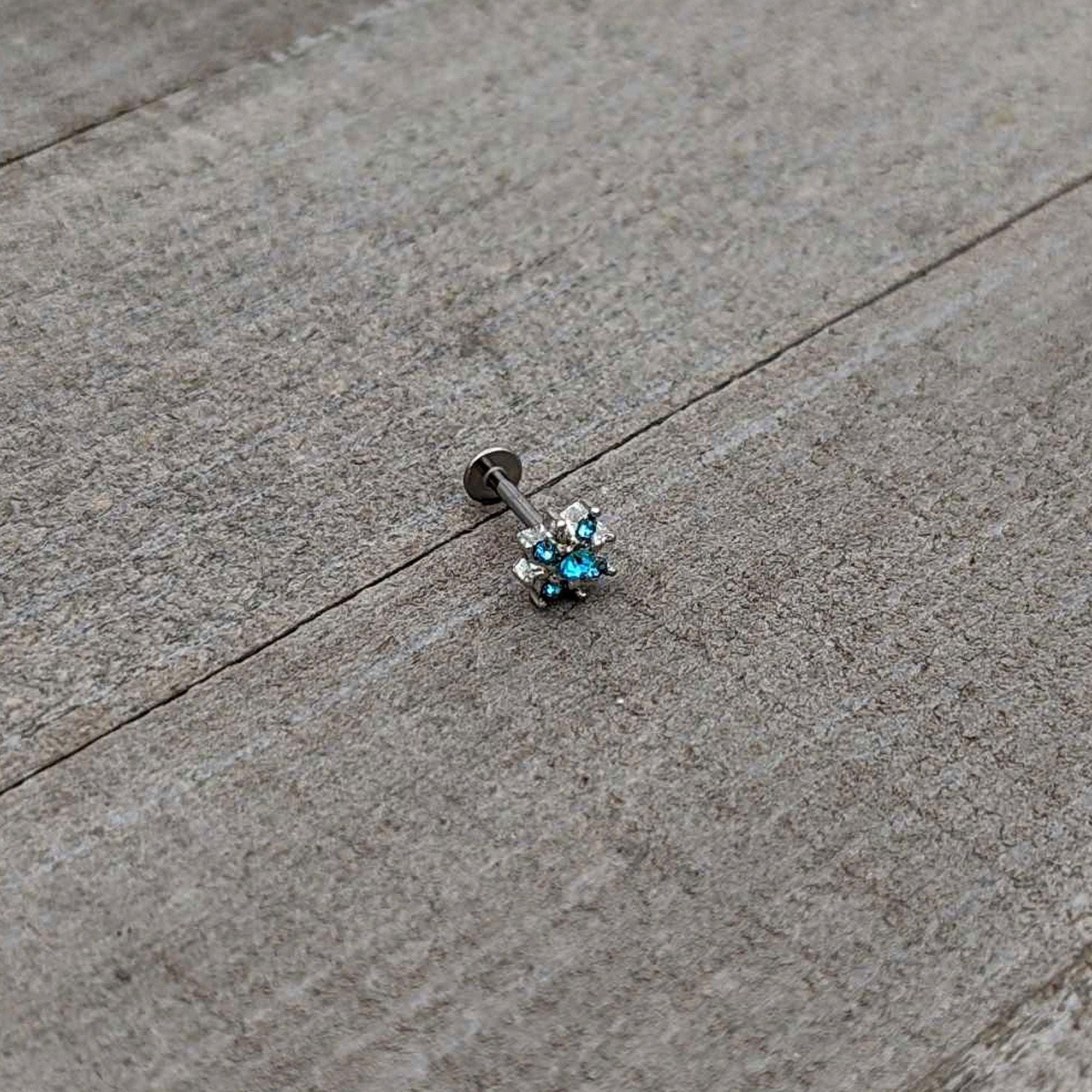 BodyCandy 16G 5/16 Blue Gem Stylish Snowflake Labret Monroe Tragus — in-use photo