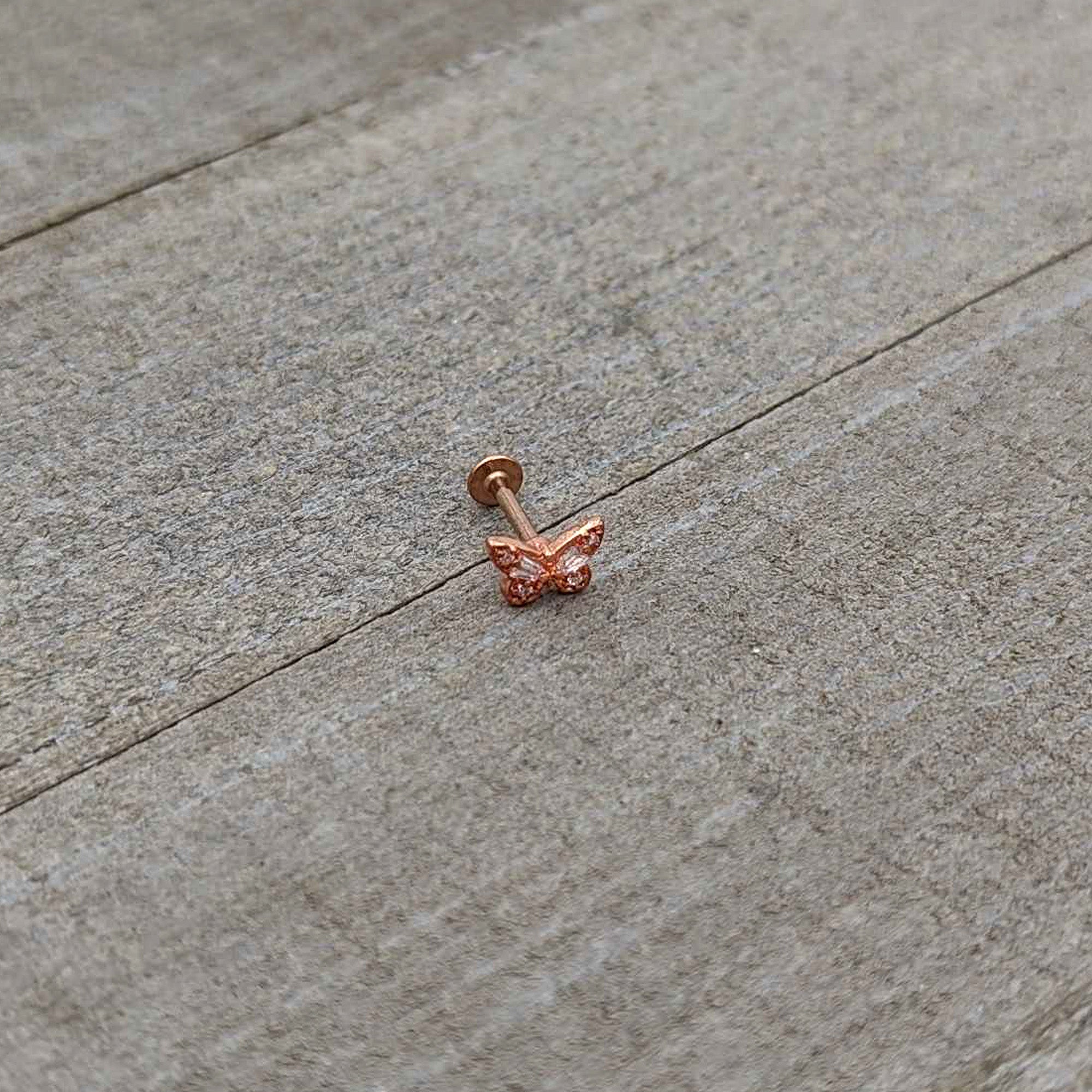 BodyCandy 16G 5/16 Clear Gem Rose Gold Tone Opulent Butterfly Labret Tragus — in-use photo