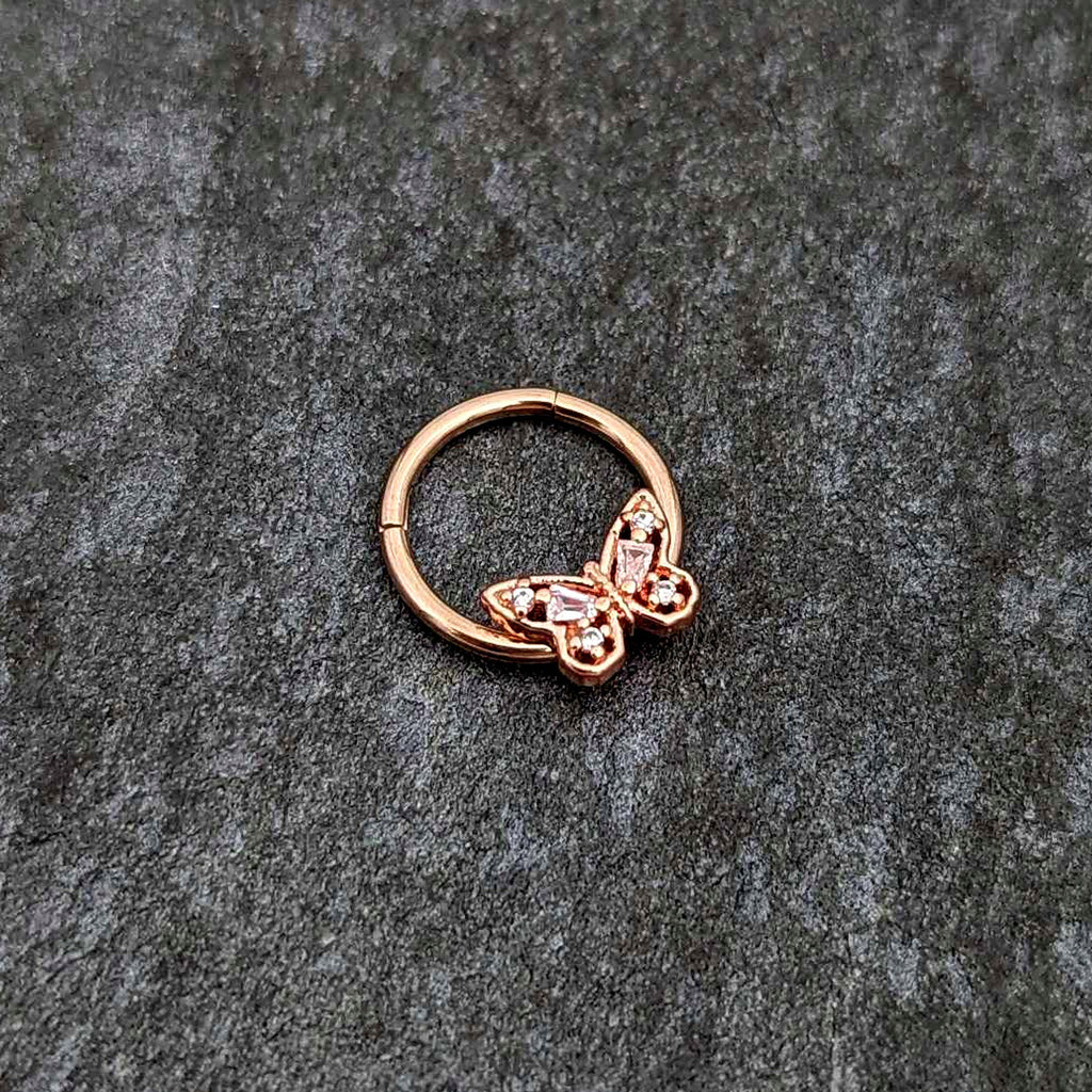 BodyCandy 16G 3/8 Clear Gem Rosy Tone Baroque Butterfly Hinged Segment Ring — side view