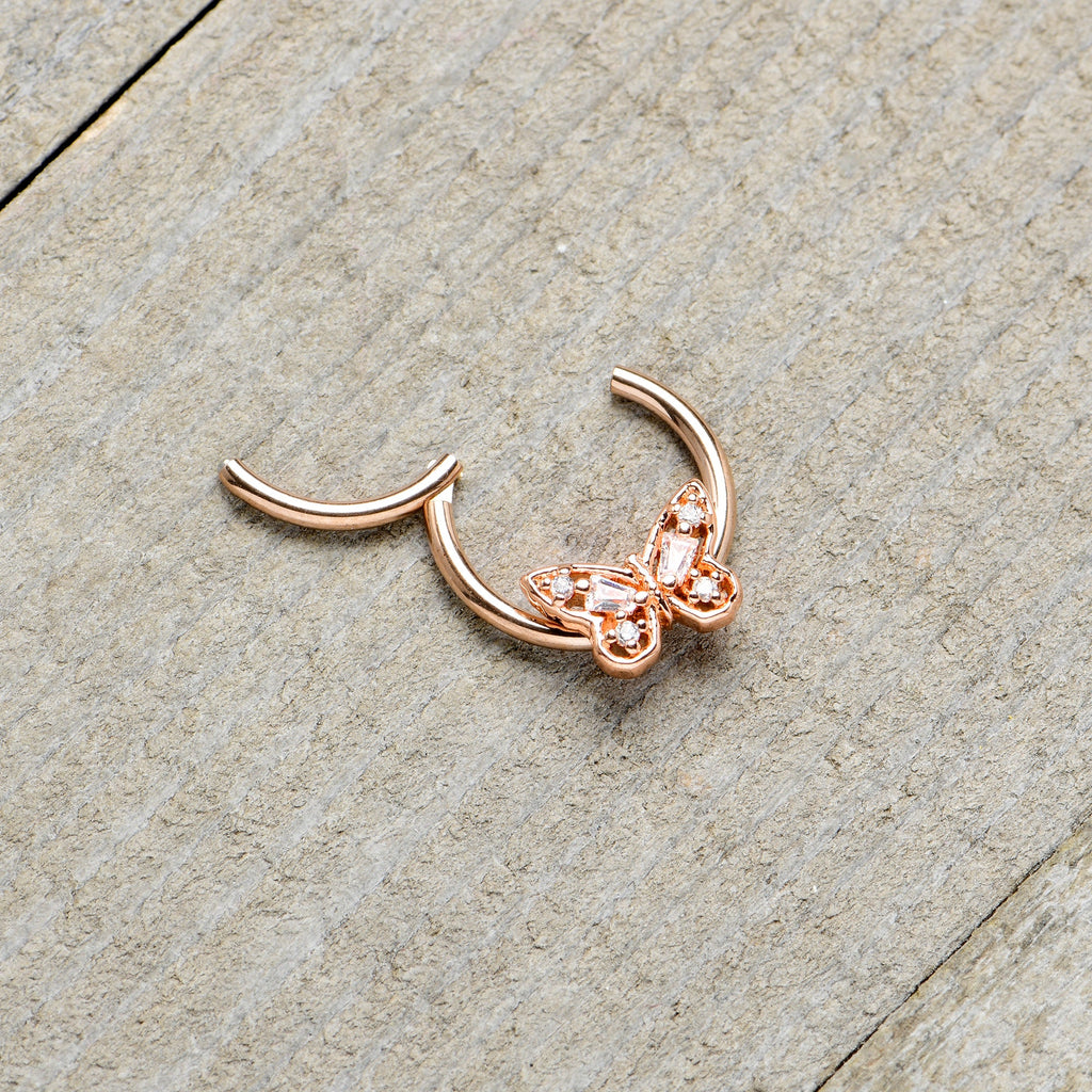 BodyCandy 16G 3/8 Clear Gem Rosy Tone Baroque Butterfly Hinged Segment Ring — in-use photo
