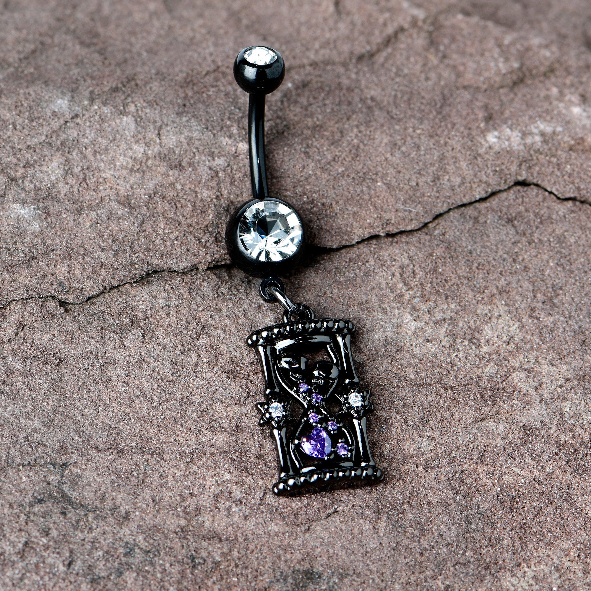 BodyCandy Clear Purple Gem Black Goth Heart Skulls Hourglass Dangle Belly Ring — in-use photo