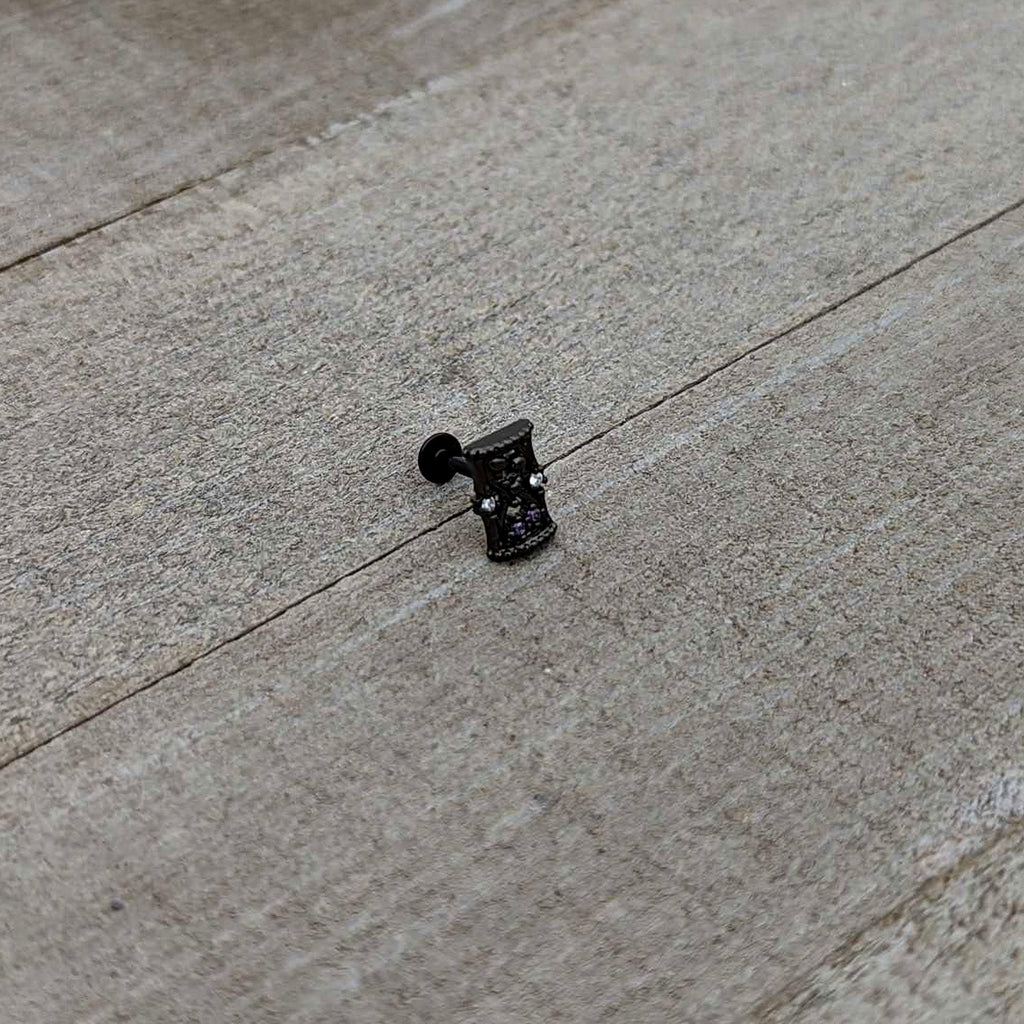 BodyCandy 16G 5/16 Purple Gem Black Gothic Hourglass Labret Monroe Tragus — in-use photo