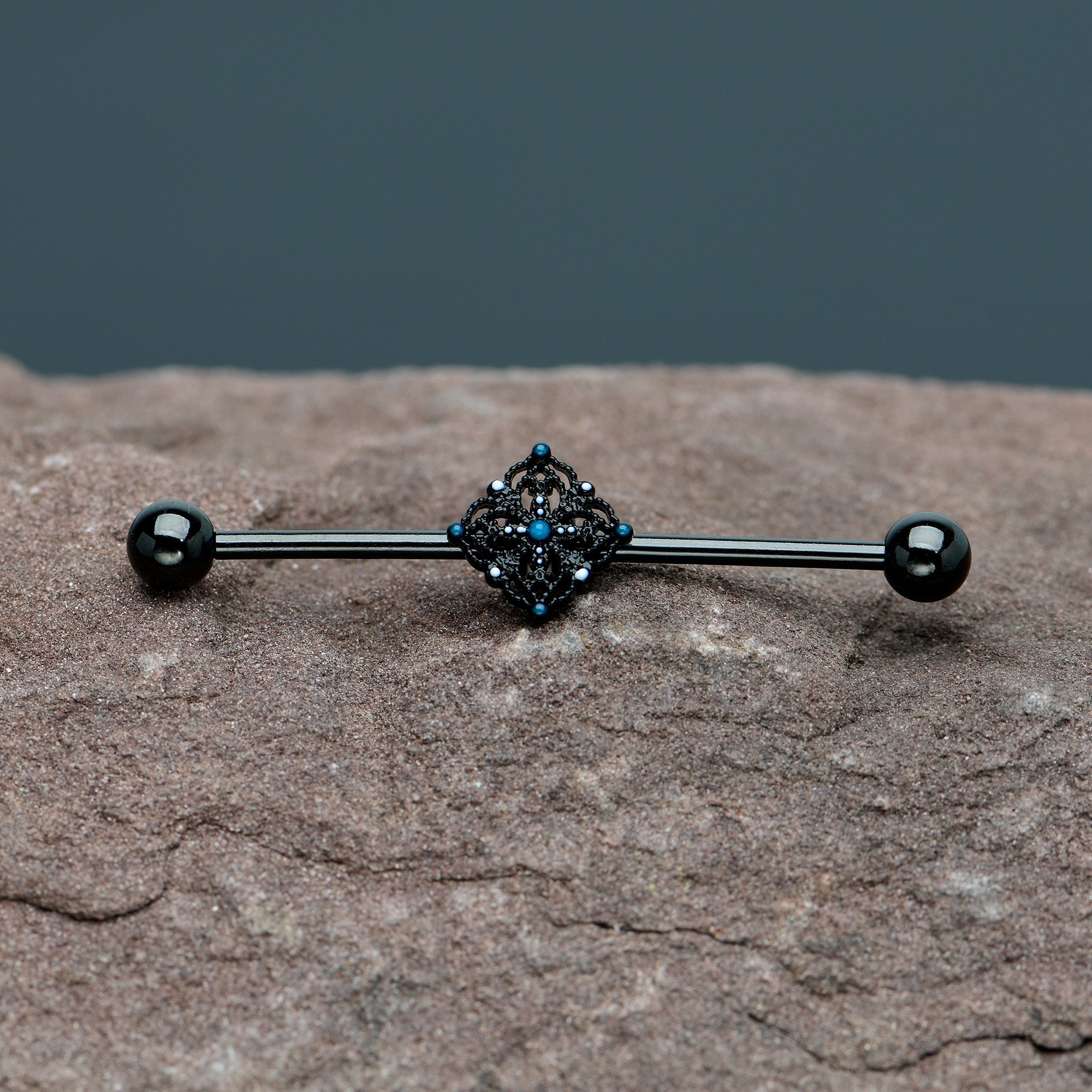 BodyCandy 14G Blue Gem Black Lacy Rhombus Industrial Barbell 38mm — in-use photo