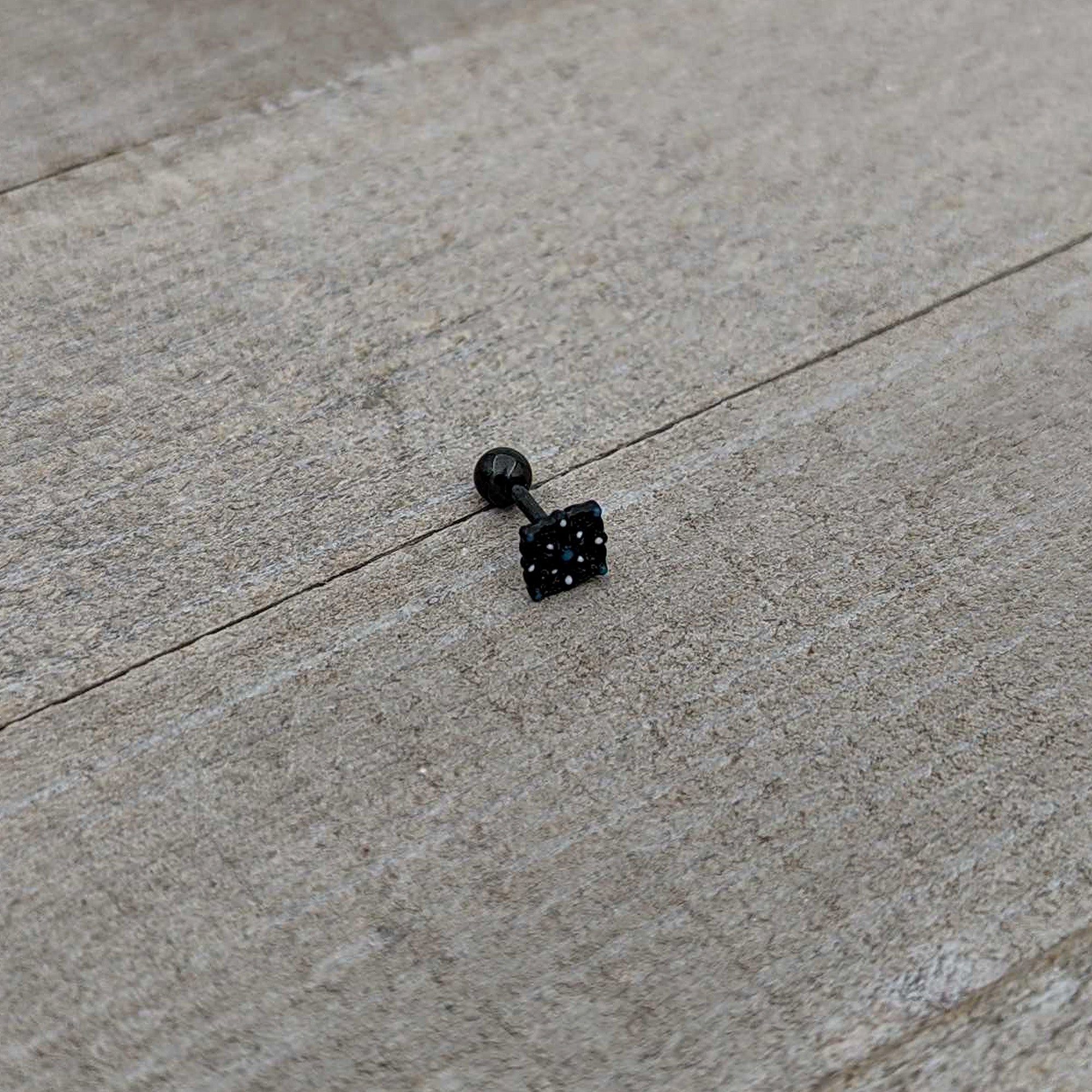 BodyCandy 16G 1/4 Blue Gem Black Lacy Rhombus Cartilage Tragus Earring — in-use photo